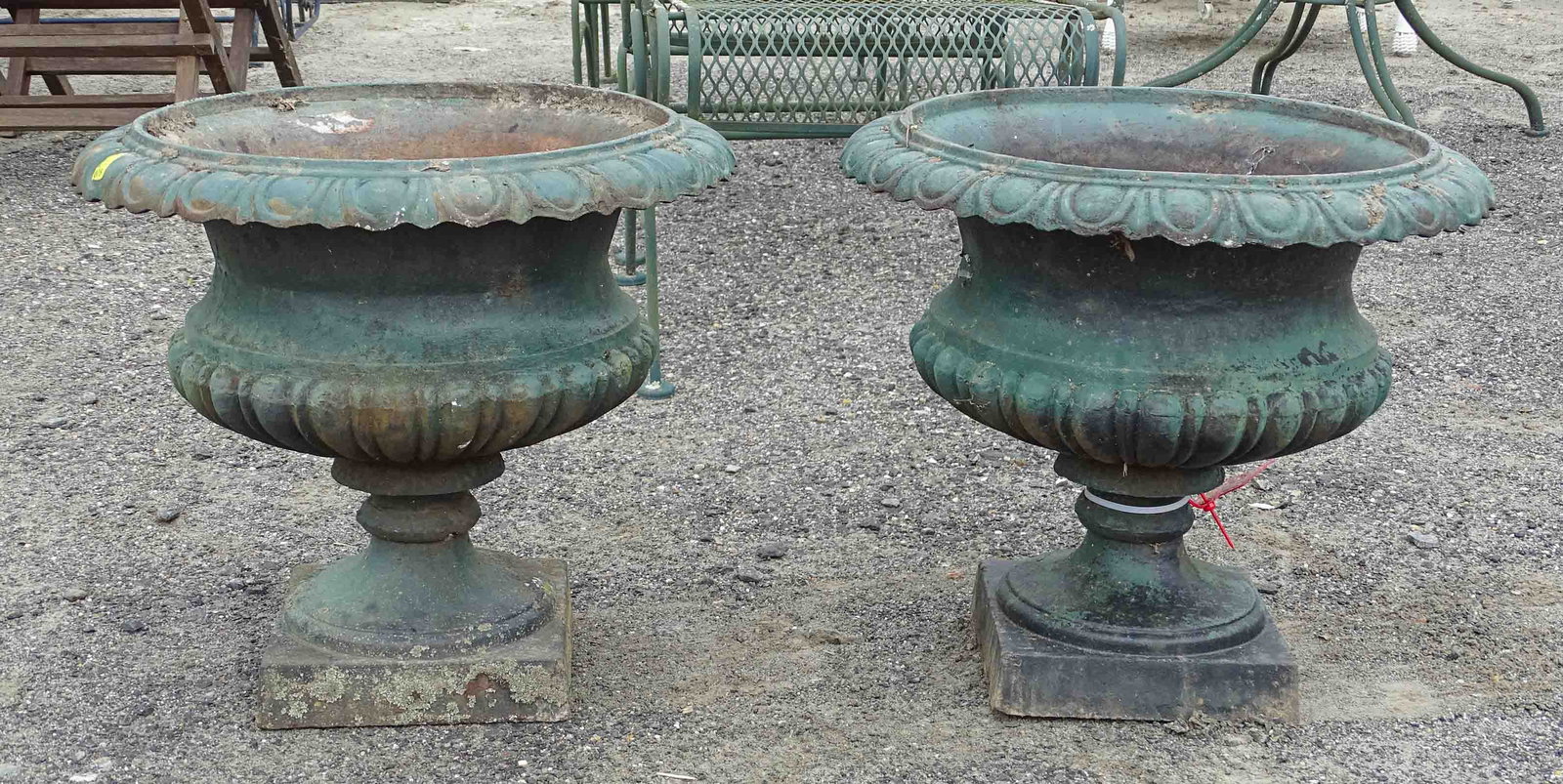Pair Cast Iron Urns: Pair of cast iron urns. 20" D., 18" Ht..