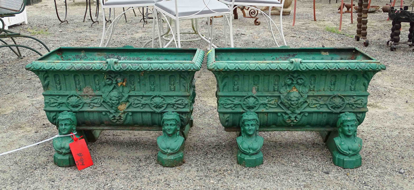 Pair Cast Iron Planters: Pair of cast iron planters on Jenny Lind head bases. 26" x 13" x 17".