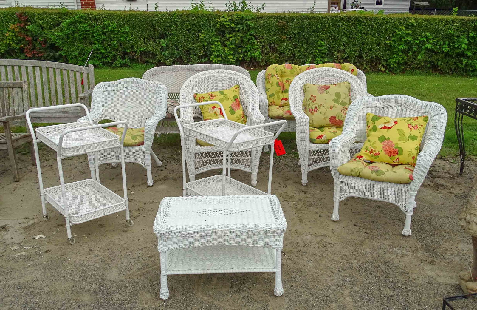 Synthetic Wicker Set: Synthetic wicker set including, (4) chairs, table, (2) rolling carts, (2) settees (48"), with cushions.