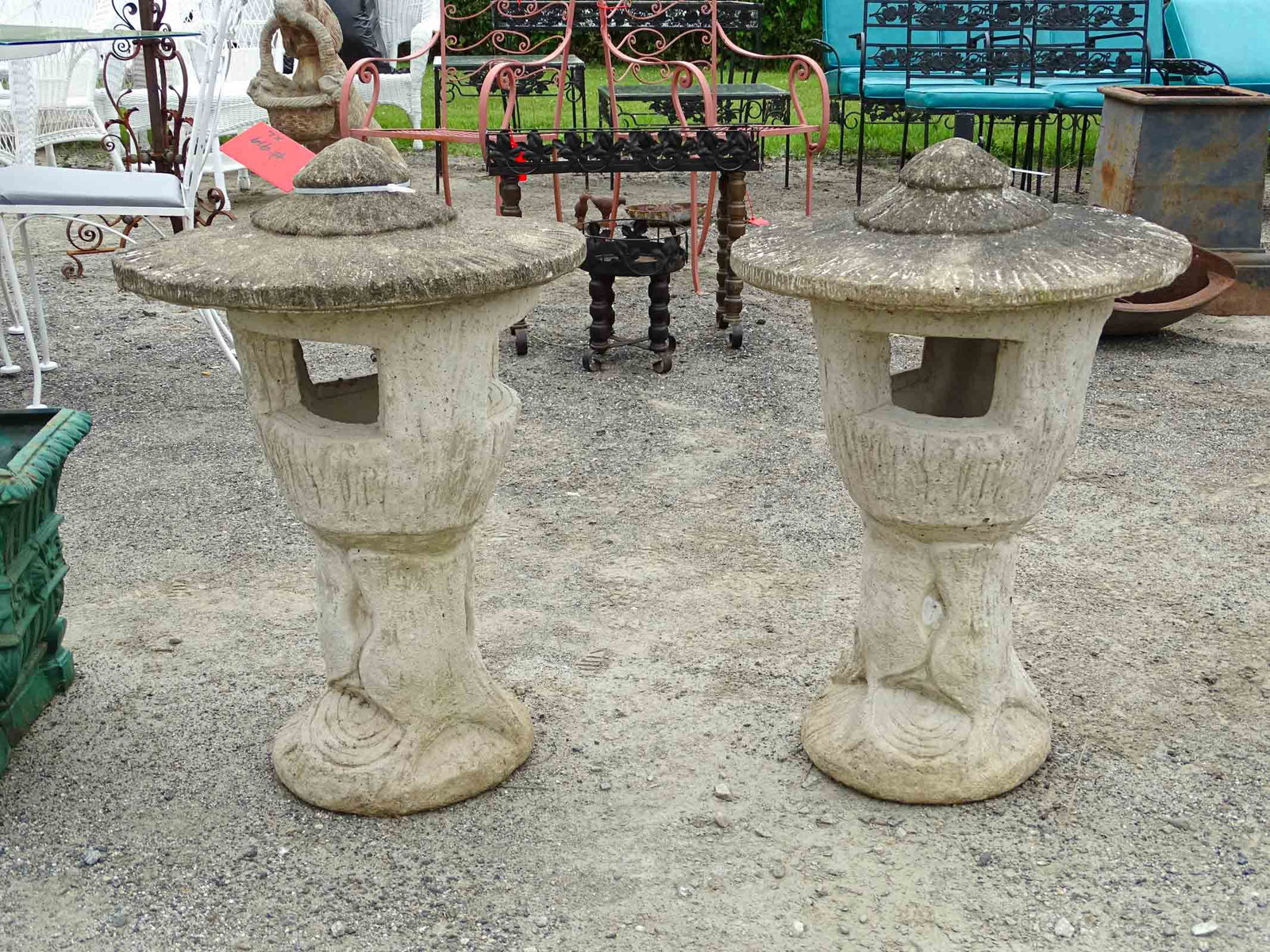 Pair Poured Stone Tree Statues: Pair of poured stone tree statues with tops. 26" Ht..
