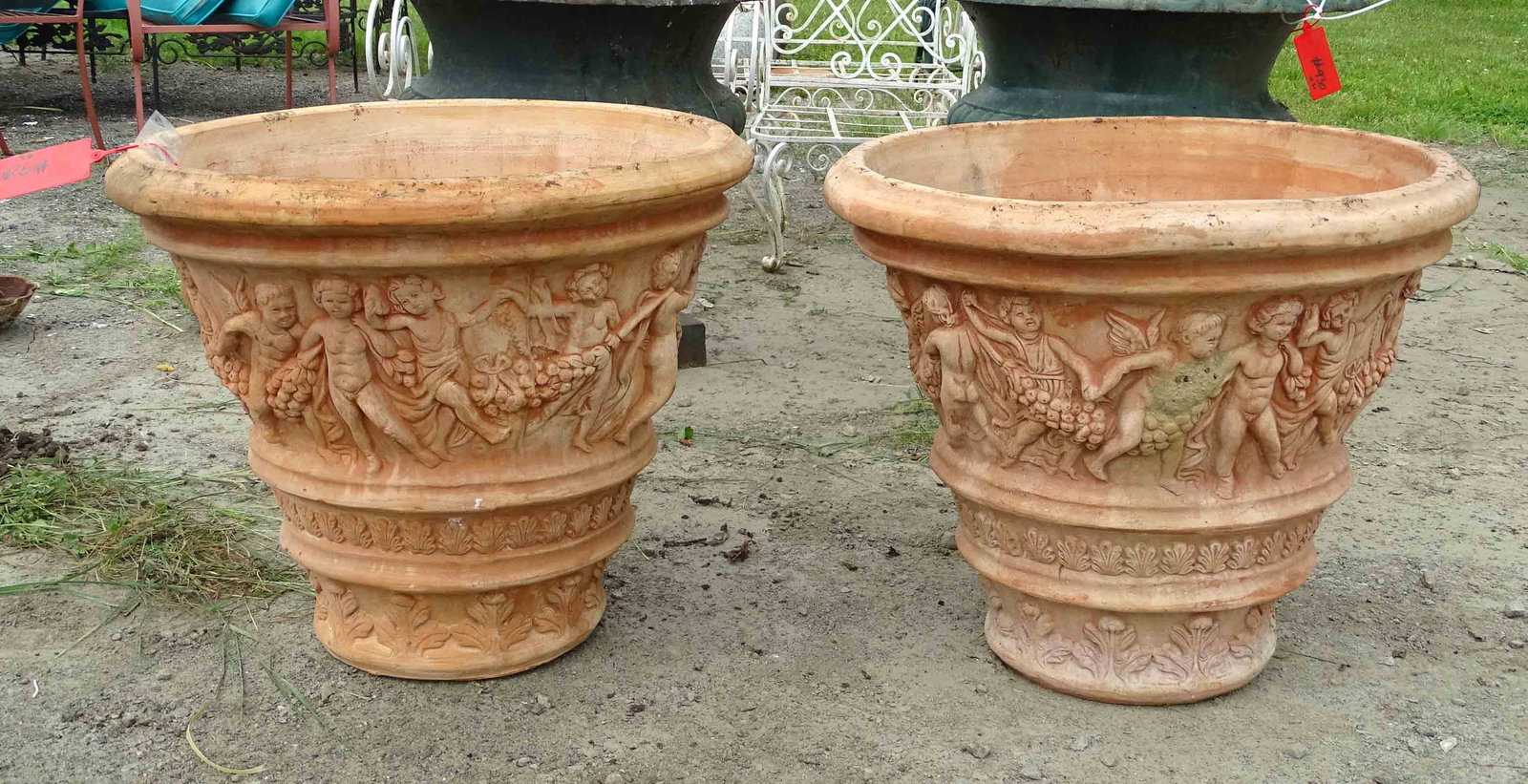 Pair Terracotta Urns: Pair of terracotta urns. 27" D., 23" Ht..