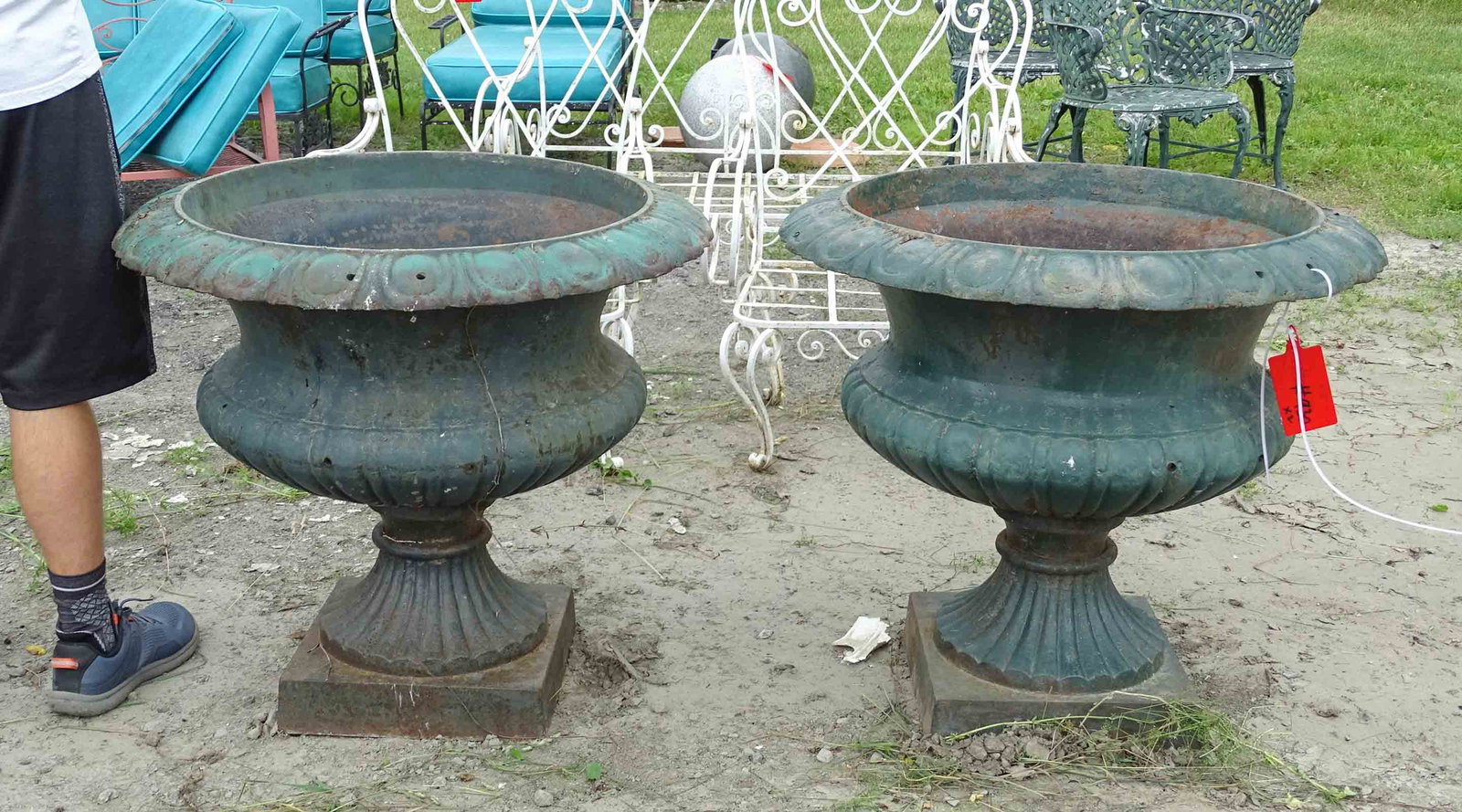 Pair Cast Iron Urns: Pair of cast iron urns. 31" D., 29" Ht..