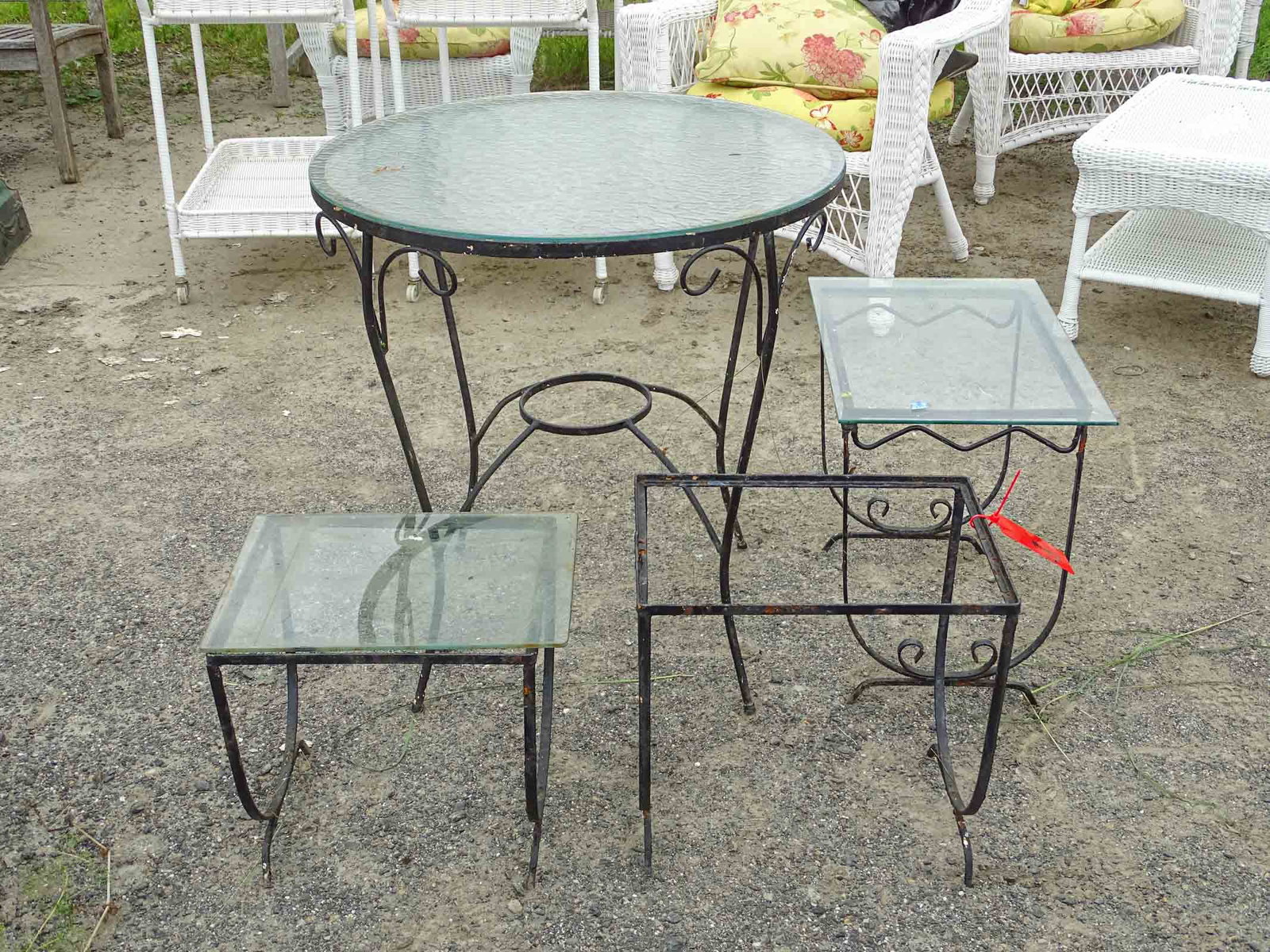 Wrought Iron Table Lot: Lot including glass top wrought iron base table and (3) wrought iron tables (2 have glass, 1 missing).