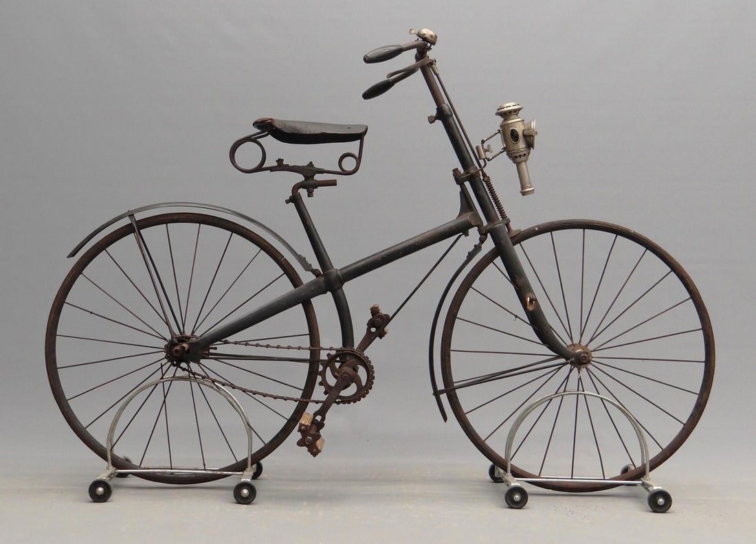Dandy Youth Hard Tire Safety Bicycle: C. 1892 "Dandy" youth hard tire safety bicycle. 17" frame. Original paint. Rear fender painted "Dandy". Retains pedals, saddle, grips, front coaster pegs, rear step, brake. Features a bell and head