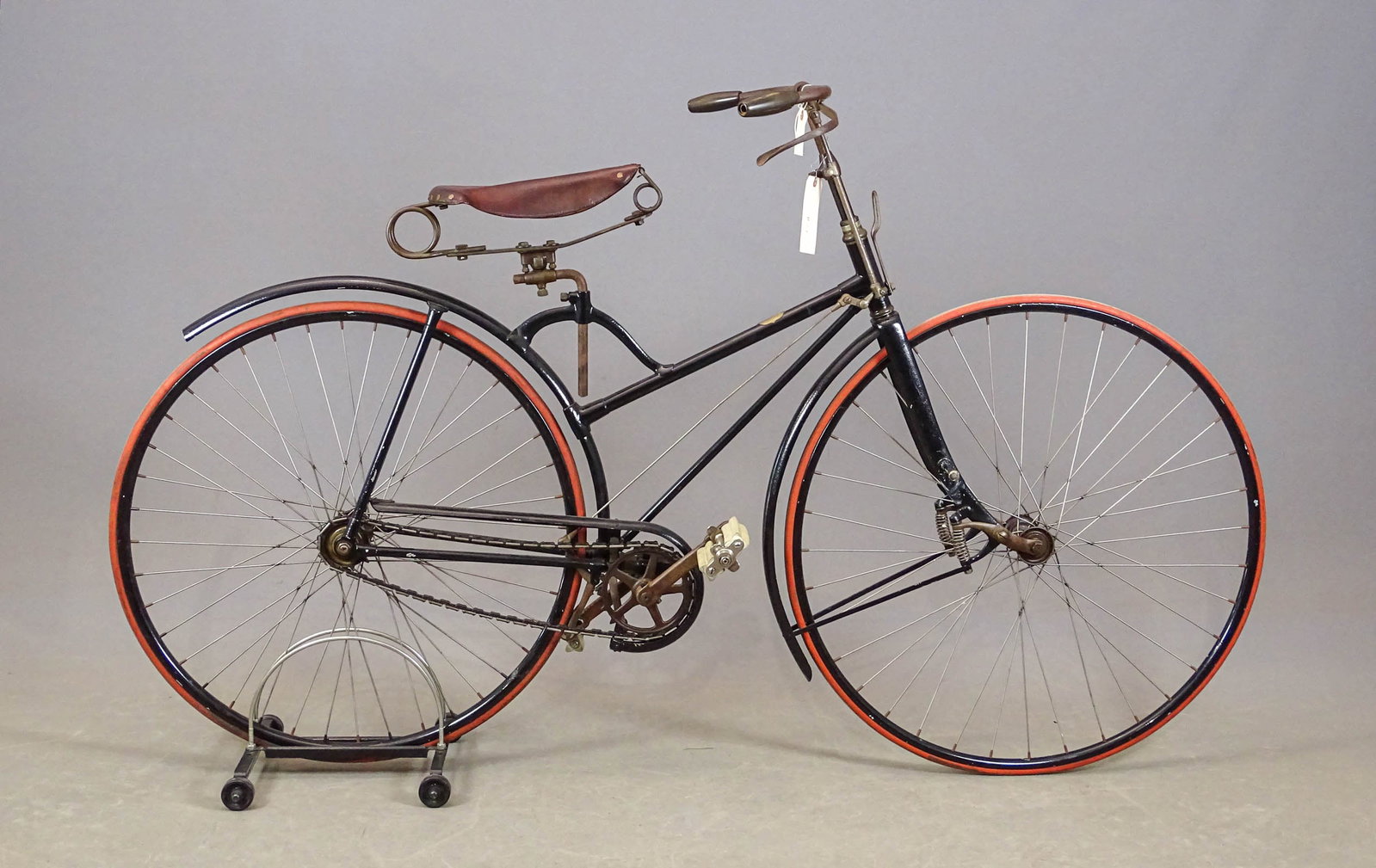 Columbia Roadster Safety: Columbia Roadster hard tire safety bicycle. Made in 1879. This bicycle has a fork made with spring actuated fork arm tips designed to smooth the ride. Good condition. Gary Sanderson Collection.