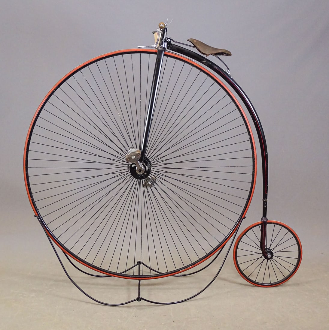 55" High Wheel Bicycle: Unknown maker 55" high wheel bicycle. Serial #1009. The name of the front Hubs maker is stamped "W. Brown" on the body of the hub. The front wheel is radially spoked suggesting its C. 1870's. Good