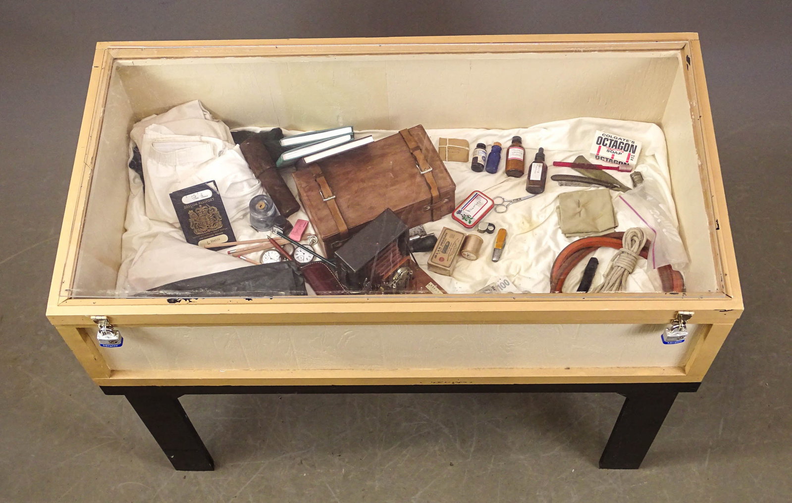 Thomas Stevens Showcase Lot: Thomas Stevens showcase lot. Includes items he may have referenced in his travels. Case overall 50" x 26" x 38 1/2" Ht.. Along with a table top showcase. Gary Sanderson Collection.