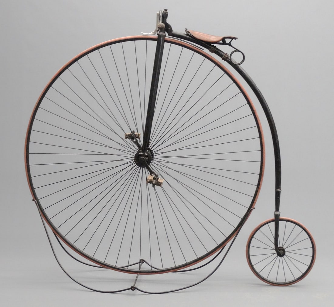 BSA High Wheel Bicycle: C. 1881 54" BSA English high wheel ordinary "Alpha" model made one year only, retains "BSA" transfer, original breaks, rideable tires. Comes with a folding stand. Good original condition. Previously