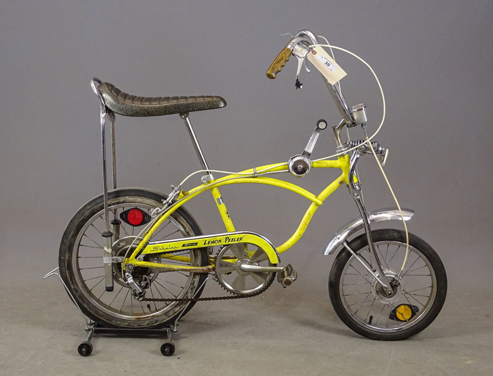Schwinn Stingray Bicycle: Vintage Schwinn Lemon Peeler Stingray bicycle. Stick shift, speedometer. Fair condition.