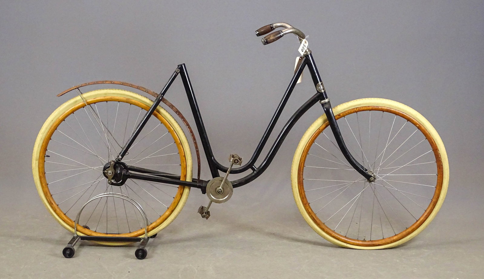 Crescent Ladies Safety Bicycle: Crescent pneumatic safety bicycle with shaft drive (chainless). 1900s - 1930s. Wood rims on the wheels. Needs a seat post and a saddle. Good condition. Gary Sanderson Collection.