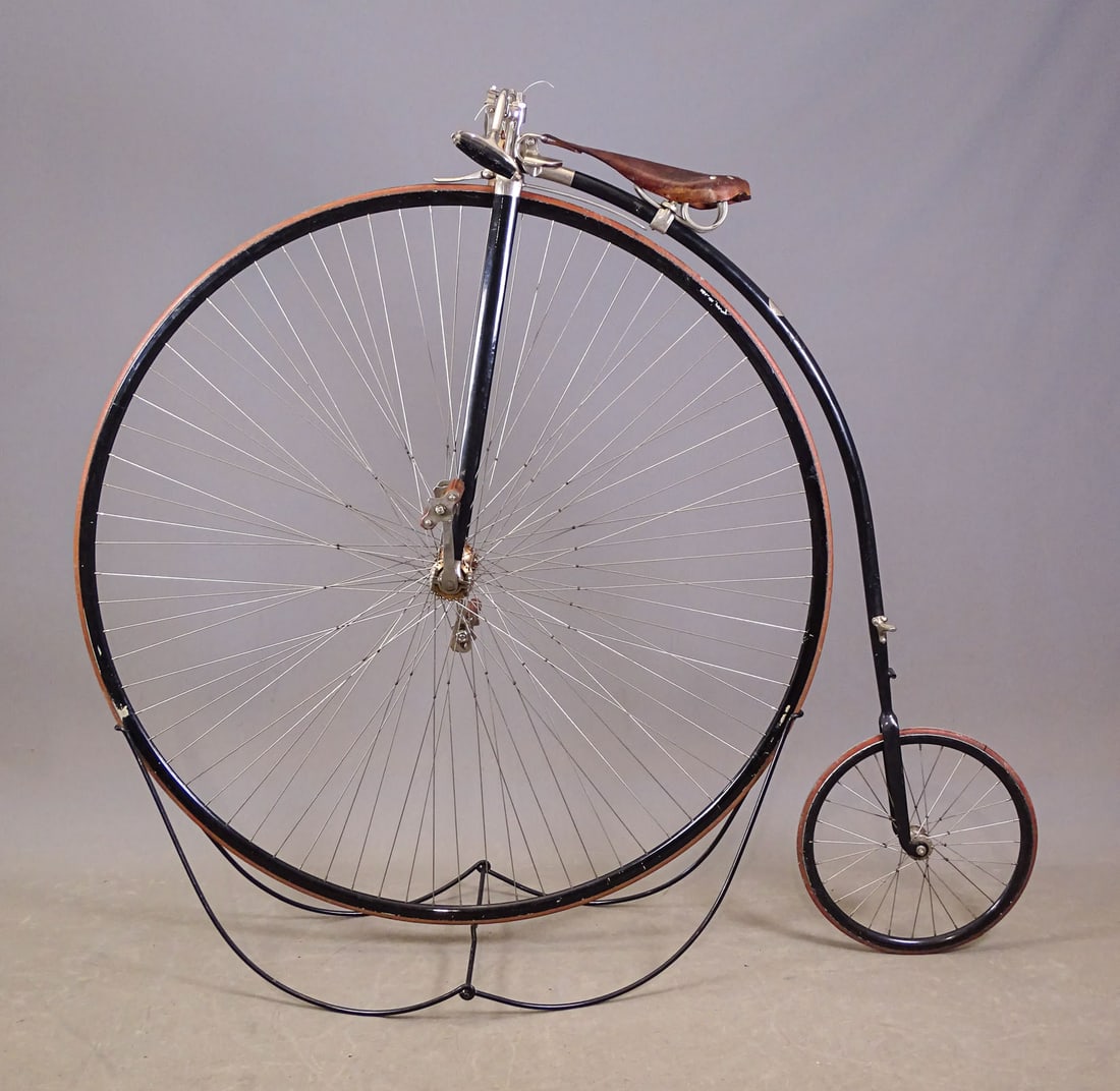Columbia Expert High Wheel Bicycle: 50" Columbia Expert high wheel bicycle with interesting seat spring. on seat. Good condition. Gary Sanderson Collection.
