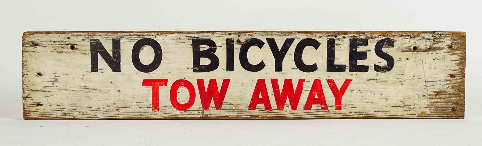 Sign: Painted wooden sign "NO BICYCLES TOW AWAY". 5" x 24". Good condition.75