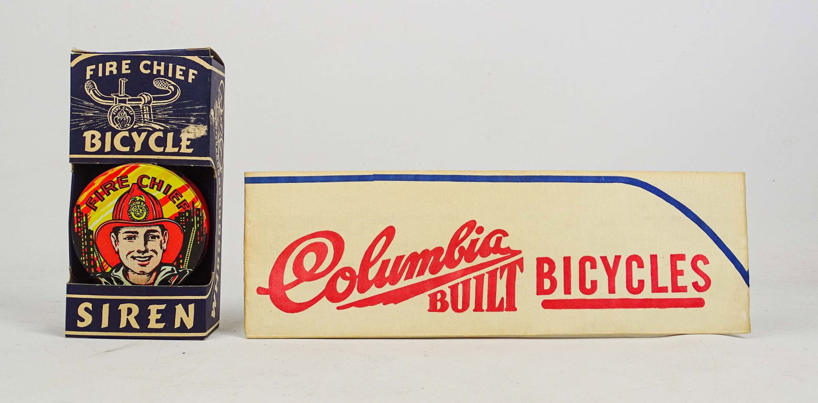 Fire Chief Bicycle Siren Lot: Lot: "Fire Chief" bicycle siren (in box), paper "Columbia Built Bicycles" cap. Both good condition.