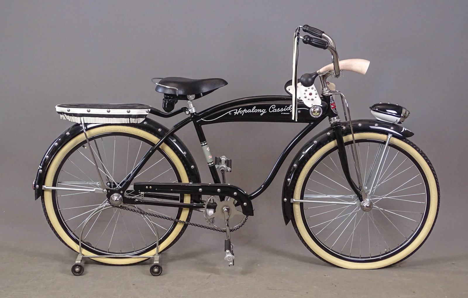 C. 1950's Hopalong Cassidy Bicycle: C. 1950's 24" Hopalong Cassidy balloon tire bicycle.. 17" frame. Has rear rack, holsters, tank badges, horn, front light. Restored by William Layman in Pittsburgh Penna..