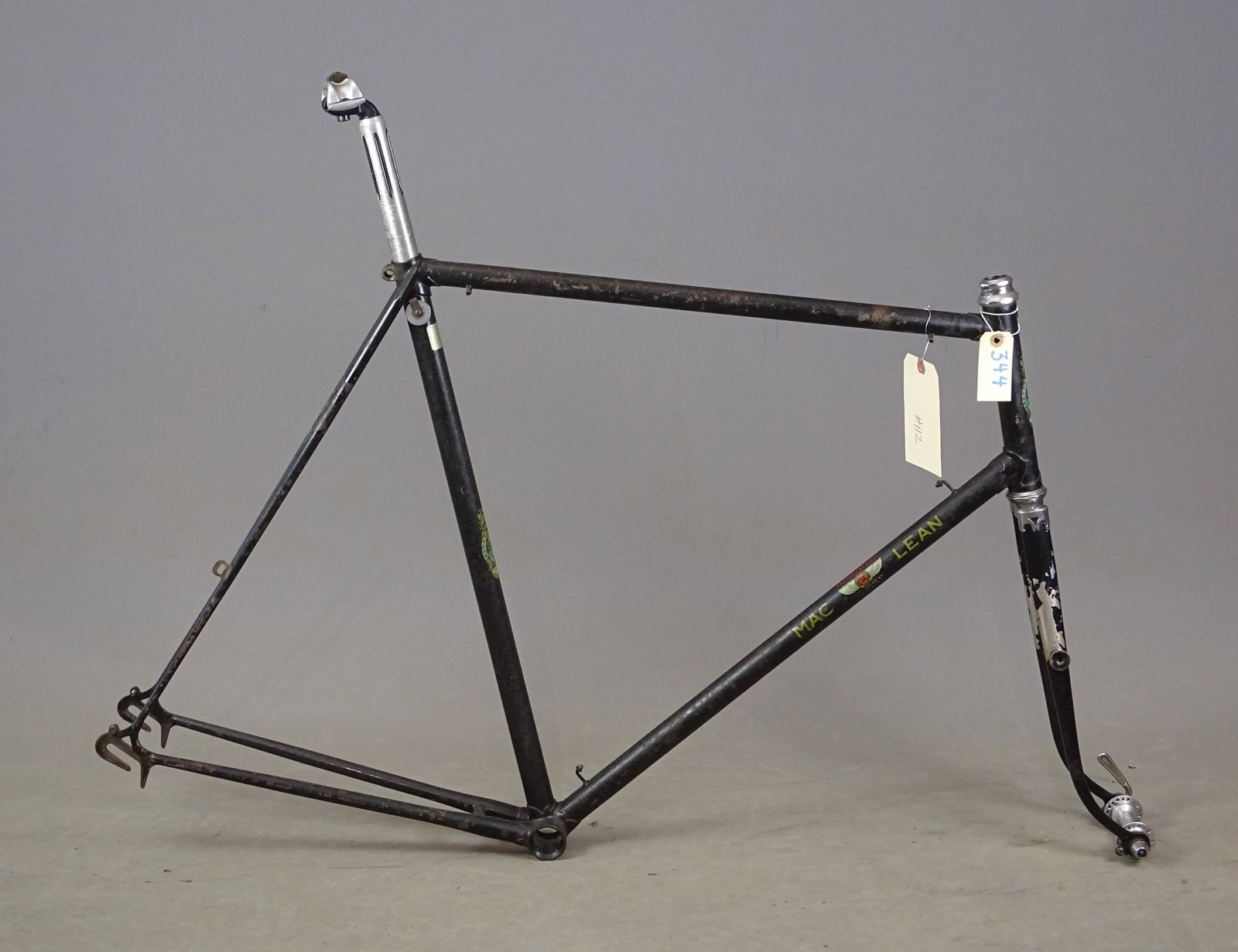 Mclean Bicycle Frame: C. 1920's Mclean bicycle frame made in Enland. Makers badge in a decal on headtube. Parts attached to the frame, headset, seat post, front wheel hub (no wheel), black paint on frame with decal