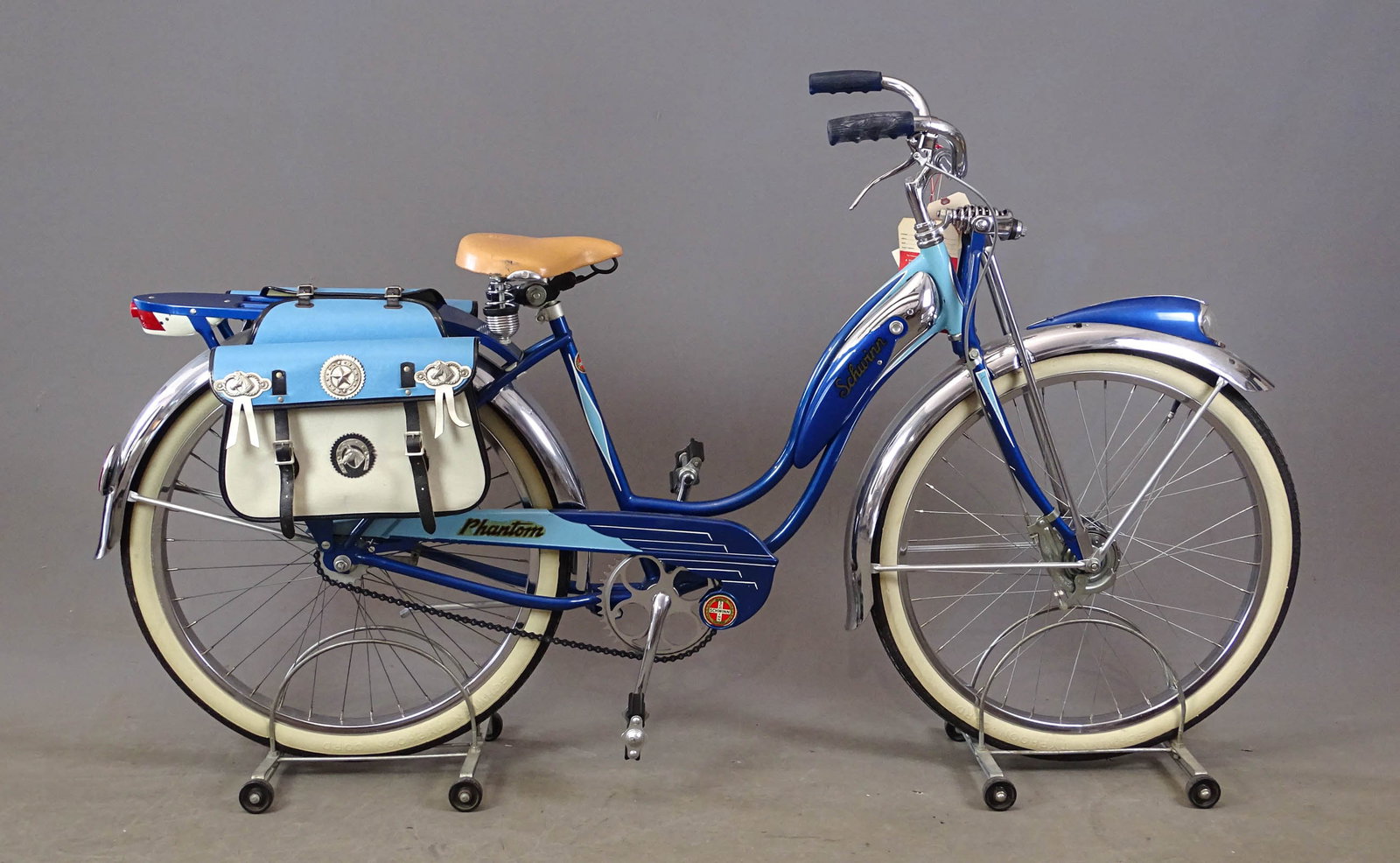 C. 1940's Schwinn Phantom Bicycle: C. 1940's Schwinn Phantom 26" balloon tire bicycle. 18" frame. Side saddles, Troxel saddle, rear rack,Schwinn Typhoon Cord whitewall tires . Original condition.