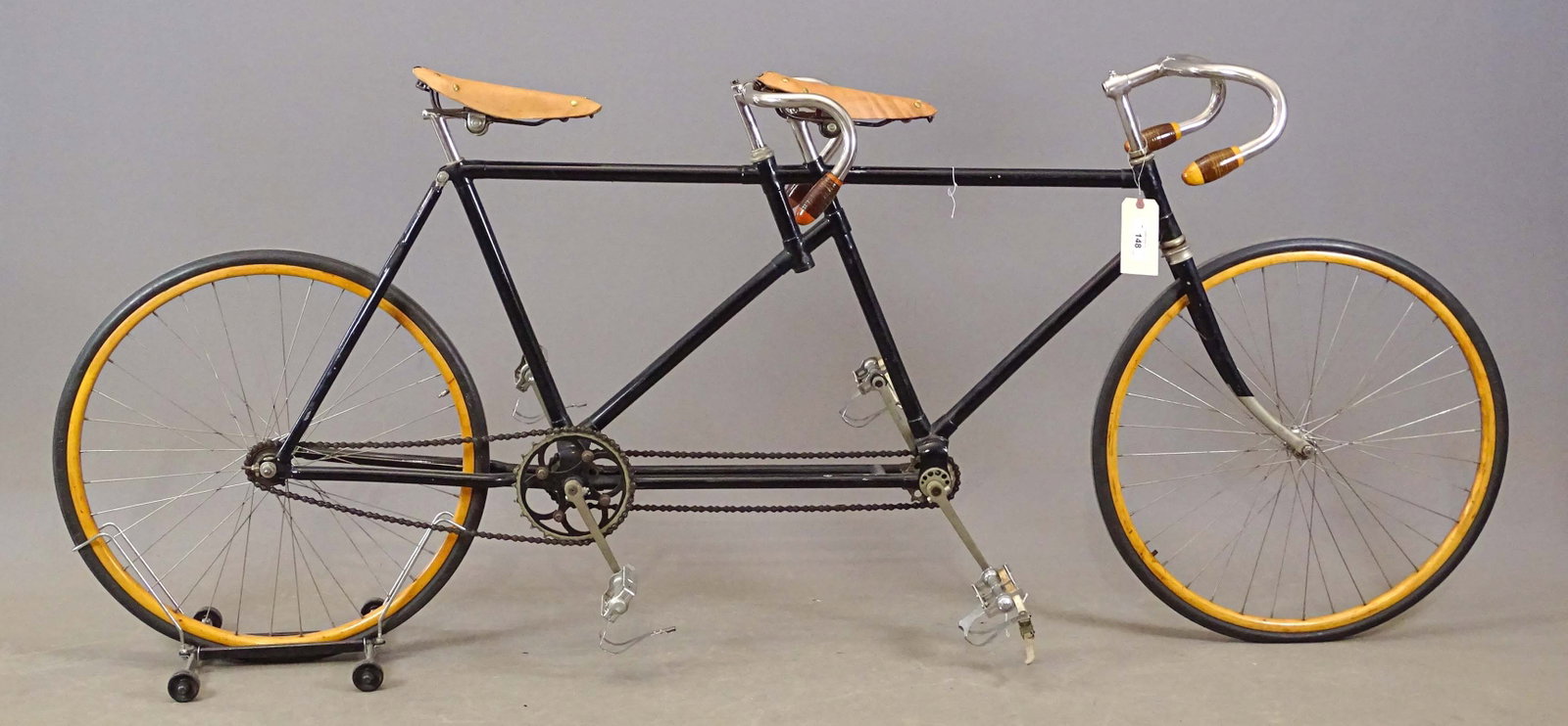 Pneumatic Safety Tandem: C. 1890's Pneumatic Safety tandem. 21" frame, Brooks saddles, variegated wooden grips.