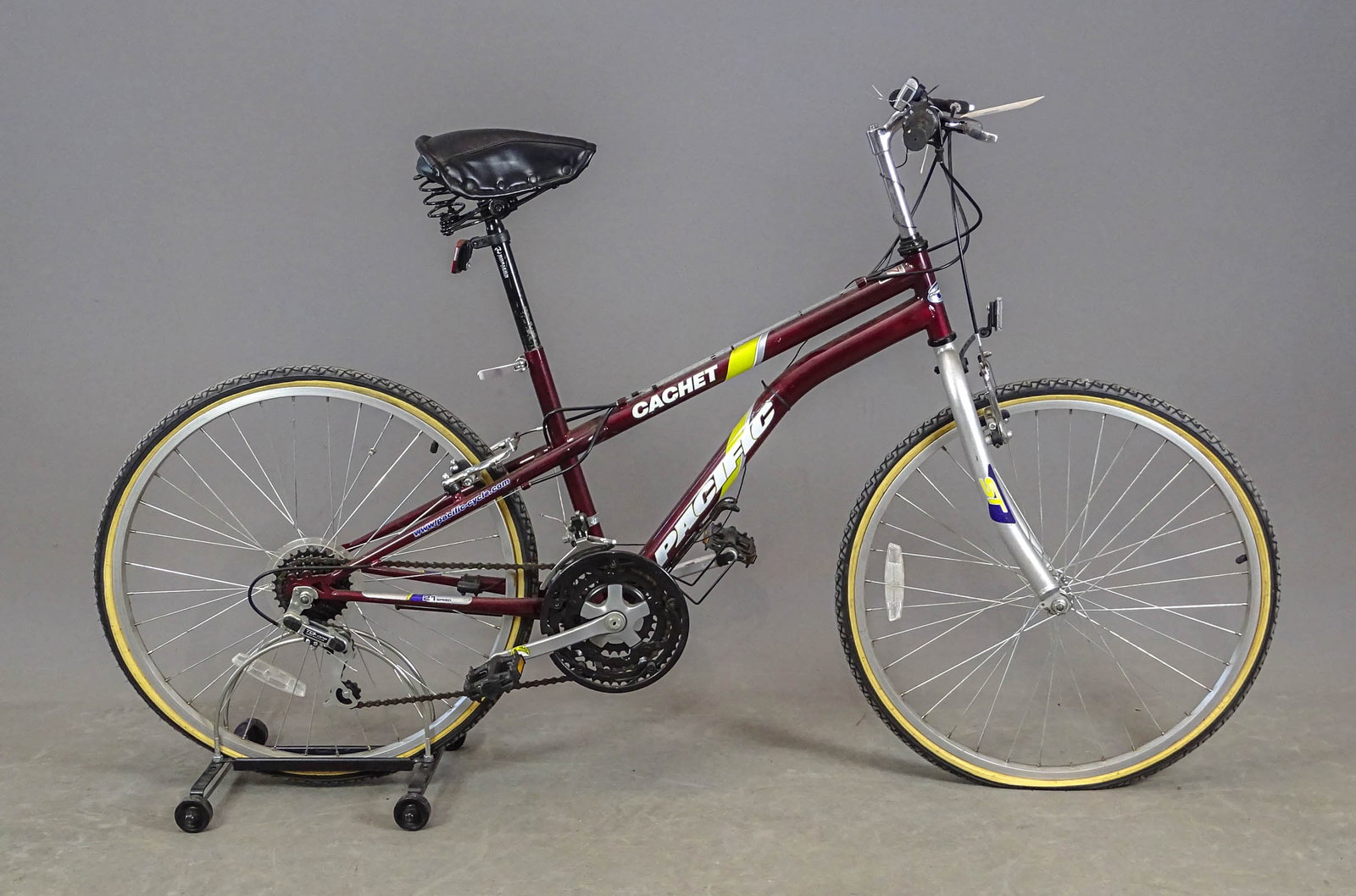 Pacific Cachet Bicycle: Pacific "CACHET" bicycle. Made in USA. Unisex frame. Color: frame - maroon, and forks - light grey. Caliper brakes on front and rear wheels operated by hand on levers located on the handlebars. The
