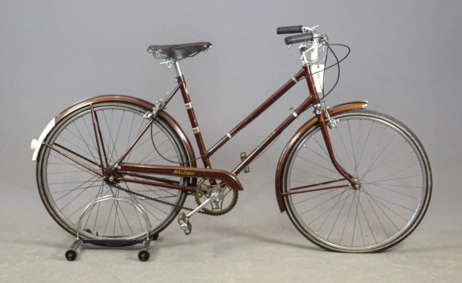 Raleigh Sports Bicycle: Raleigh "Sports" bicycle from the 1950s with 3-speed Sturmey Archer rear wheel hub. This bicycle has caliper rim brakes actuated by levers on the handlebars. It also has metal fenders in good conditio