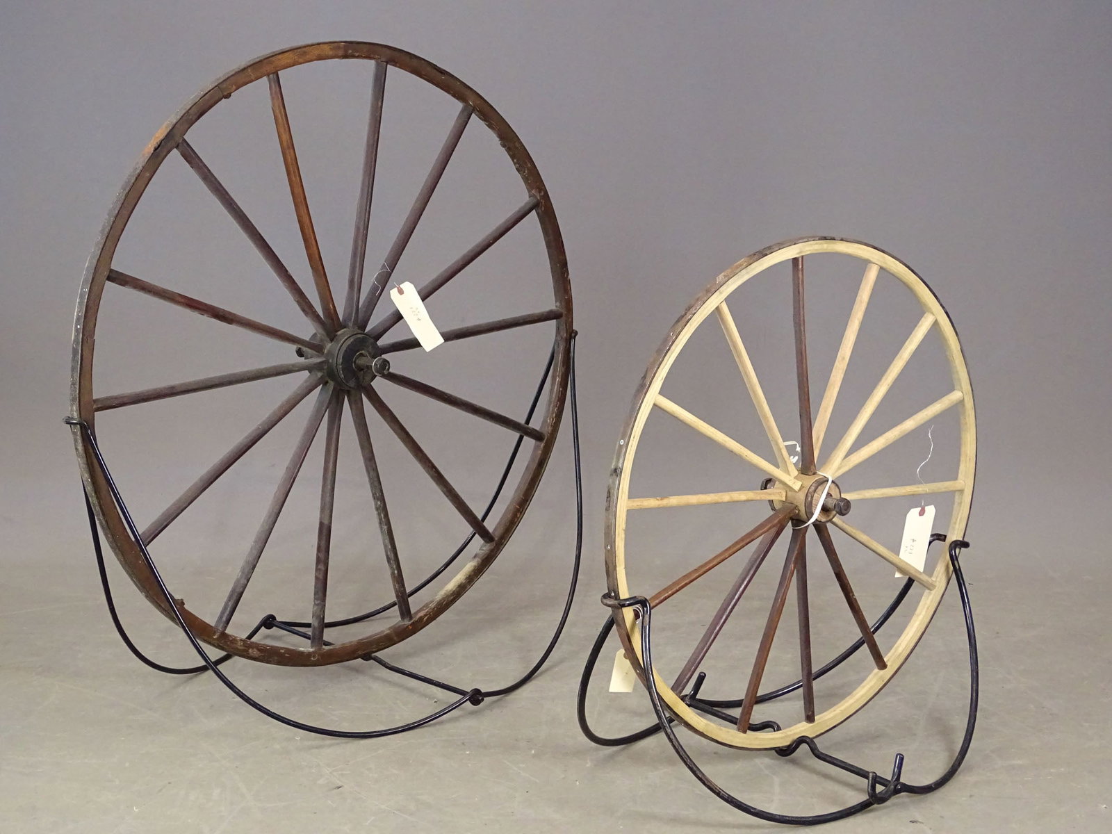 Two Wooden Wheels: Lot (2) wooden spoked wheels. 30" and 41 1/2" D.. Gary Sanderson Collection.