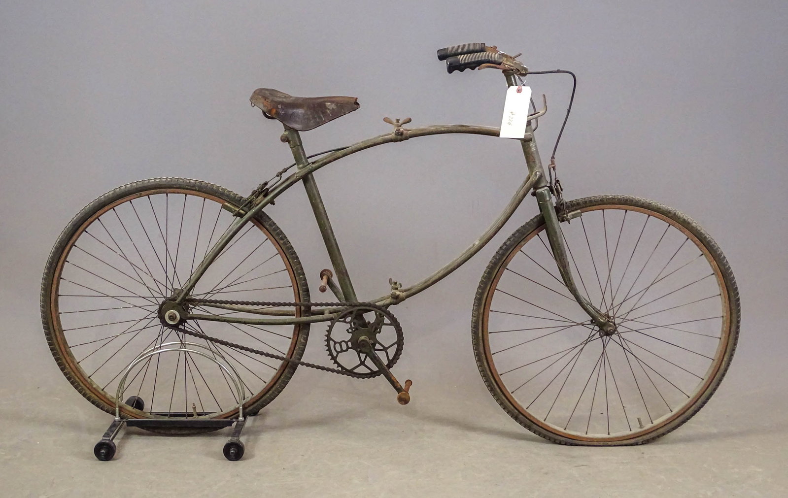 BSA Paratrooper Bicycle: BSA Paratrooper bicycle- 2nd WW model: folds in middle to facilitate carrying. The color of this machine is drab olive green. The leather saddle is complete, but the nose has been broken off, and
