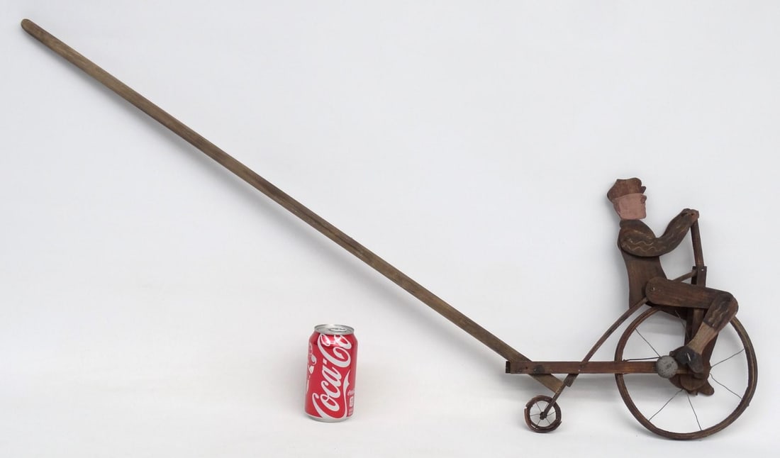 Wooden High Wheel Push Toy: Wooden high wheel push toy. 45" L.. Good condition. Provenance: Richard Roy Estate. Previously sold at Copake Auction April 2016, lot 522.