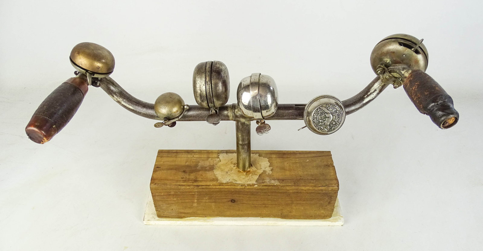Handlebars and Bells Lot: Lot including pair early handlebars with (6) early bells. Good condition. Gary Sanderson Collection.