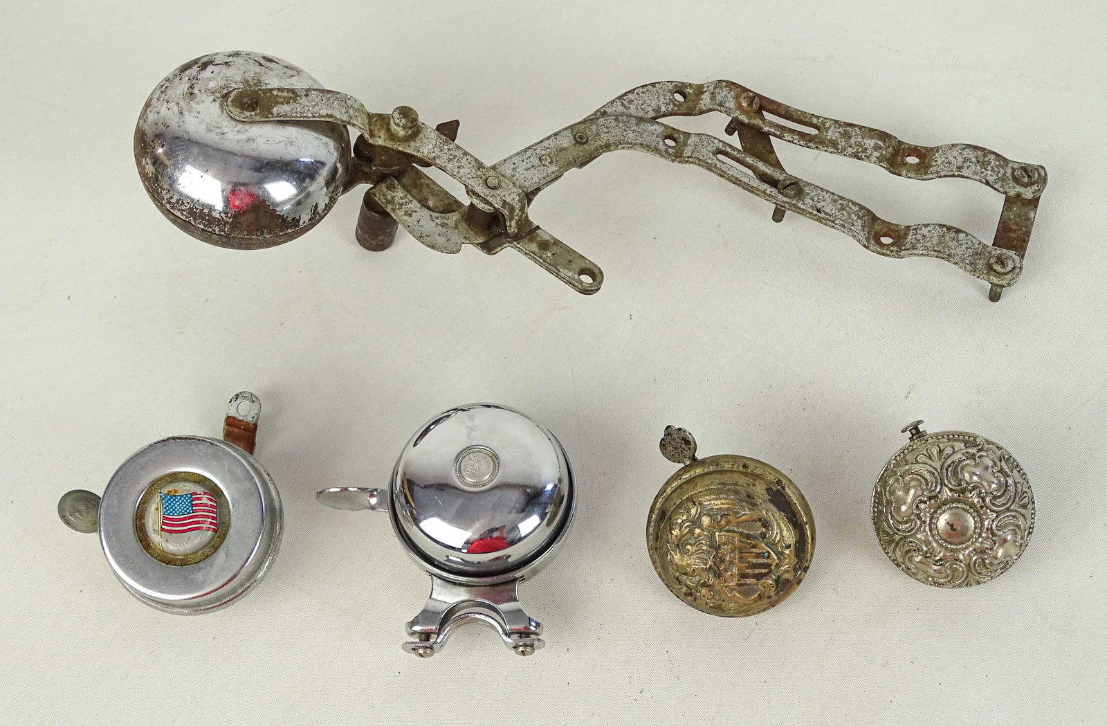 Bicycle Bells: Collection of (5) bicycle bells. Includes "SEAGULL", embossed flag and eagle. Along with noise maker. Gary Sanderson Collection.