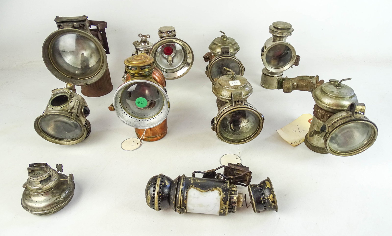 Collection of Bicycle Lamps: Collection of assorted bicycle lamps Gary Sanderson Collection.
