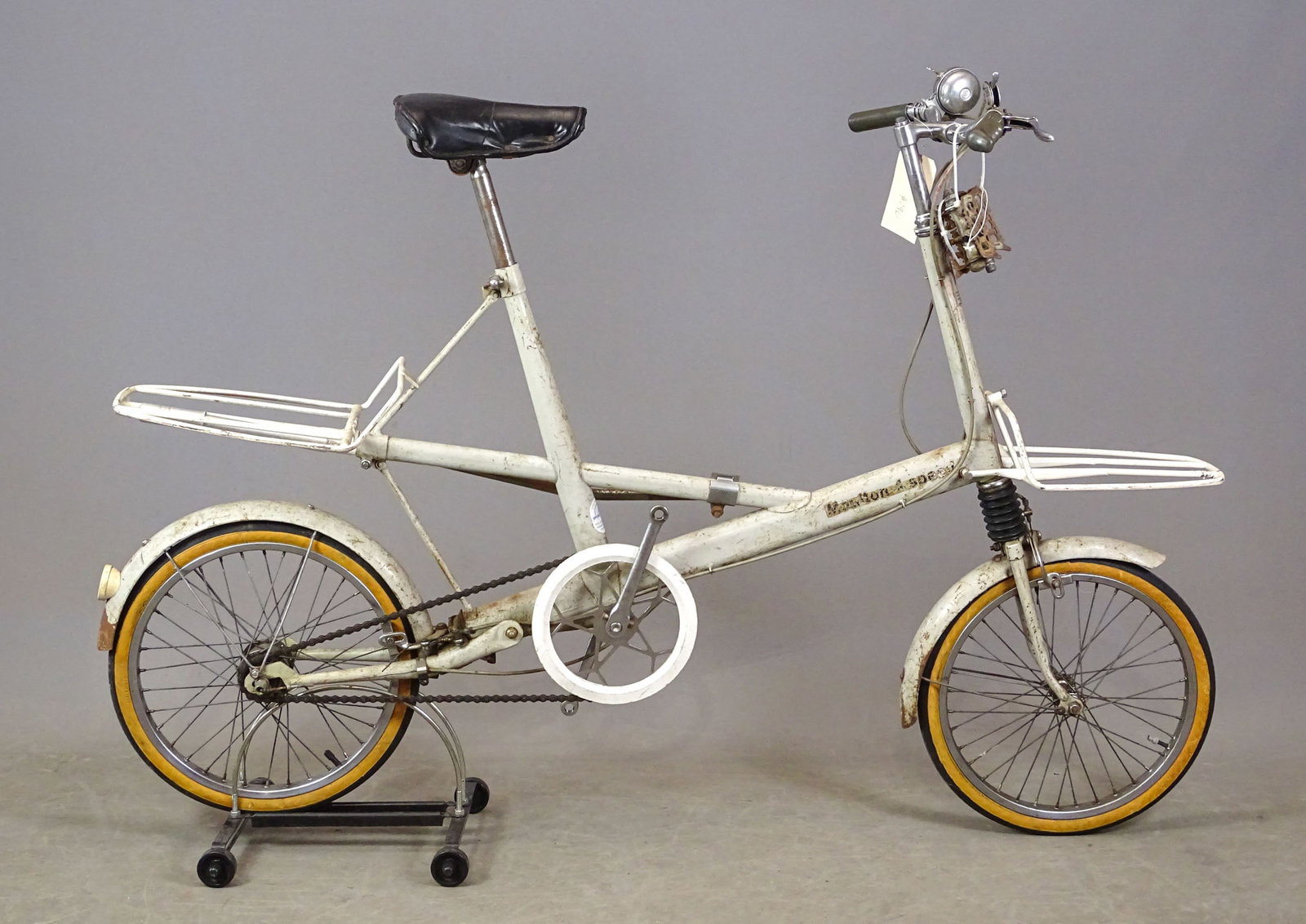 1964 Moulton Bicycle: 1964 Moulton 4-Speed white bicycle. SN#64390057. Commuter bicycle. Made in England. Has correct side stand. Fair condition.