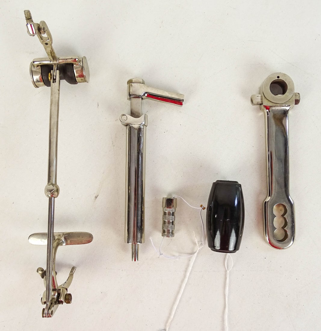 Parts Lot: Lot of early parts: Pneumatic Safety Sprung seat post (7 3/4"), High Wheel front brake lever (13 1/2"), Nickel plated mounting peg (1 5/8"), Columbia Shaft Drive grip (3"), High Wheel crank arm (7