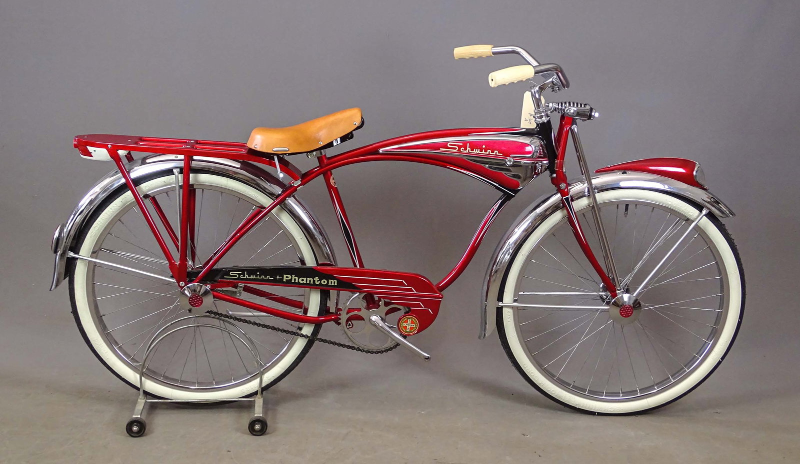 C. 1950's Schwinn Phantom Bicycle: C. 1950's Schwinn 26" red Phantom balloon tire bicycle. 18" frame, Schwinn Typhoon Cord tires. Original condition.