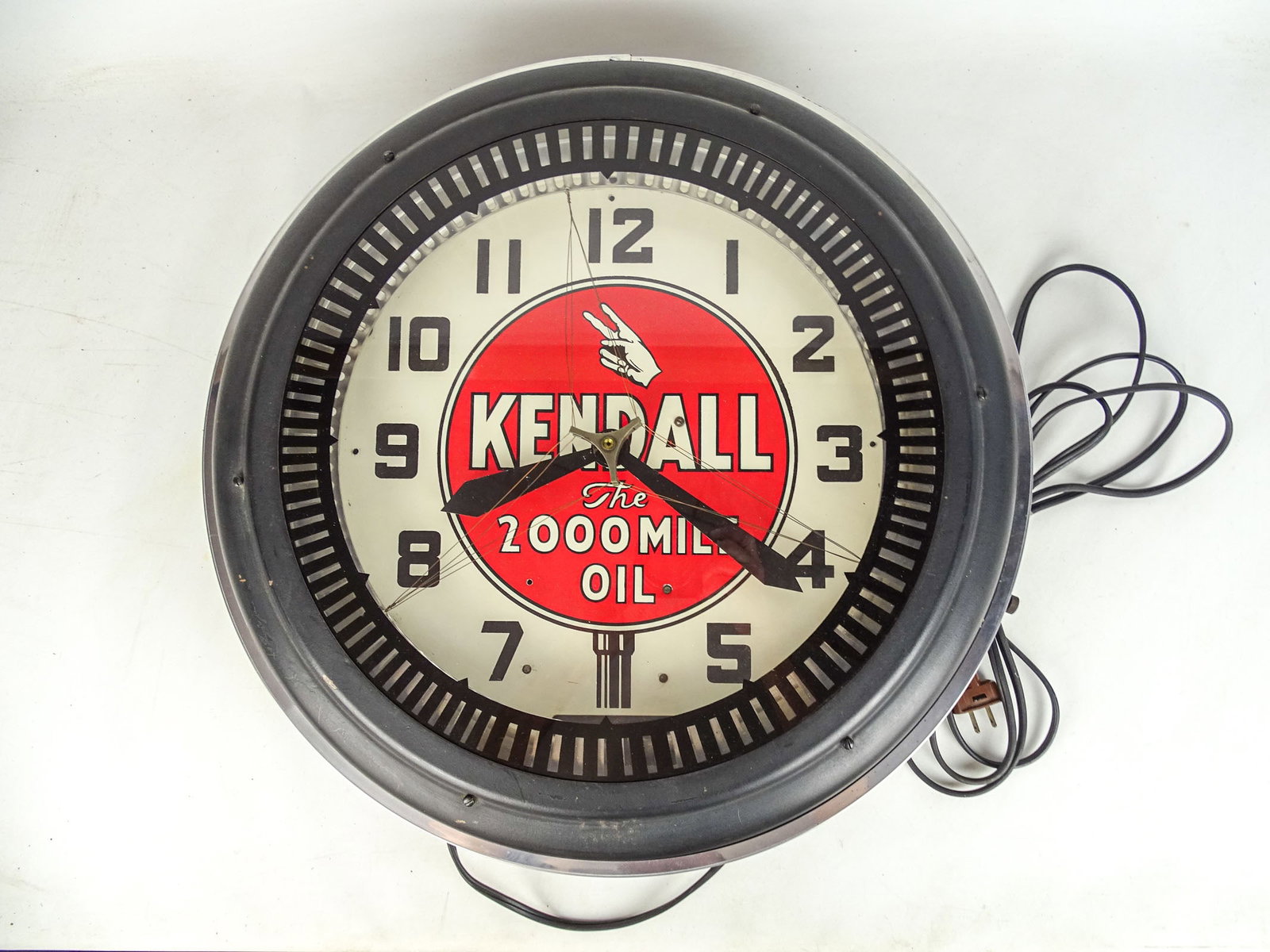 Kendall Wall Clock: Kendall wall clock "THE 2000 MILE OIL". Works. 22" D.. Good condition.