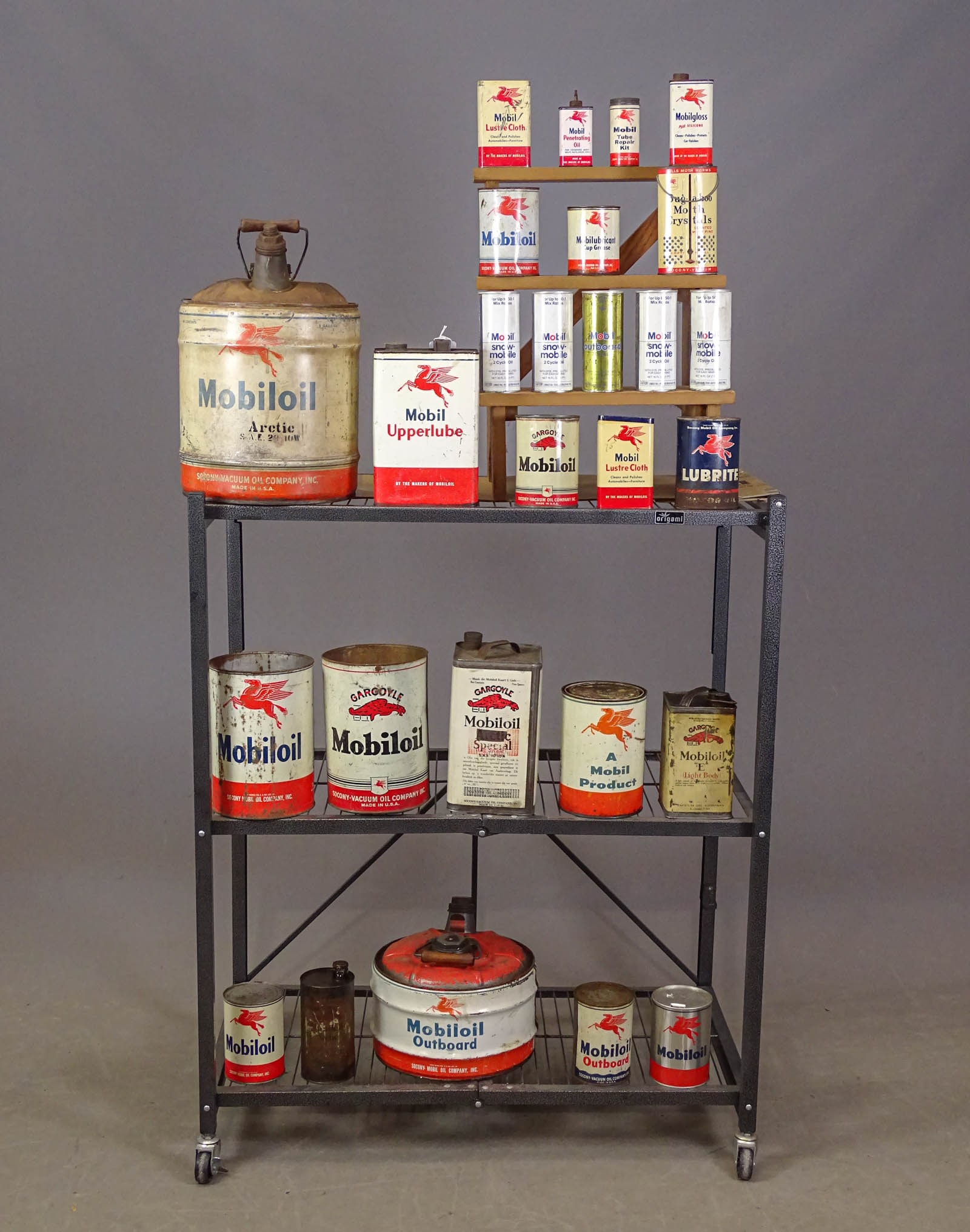 Mobil Oil Can Collection: Lot (28) vintage Mobil oil cans. Some with contents. Largest 18" Ht.. Fair-Good condition.