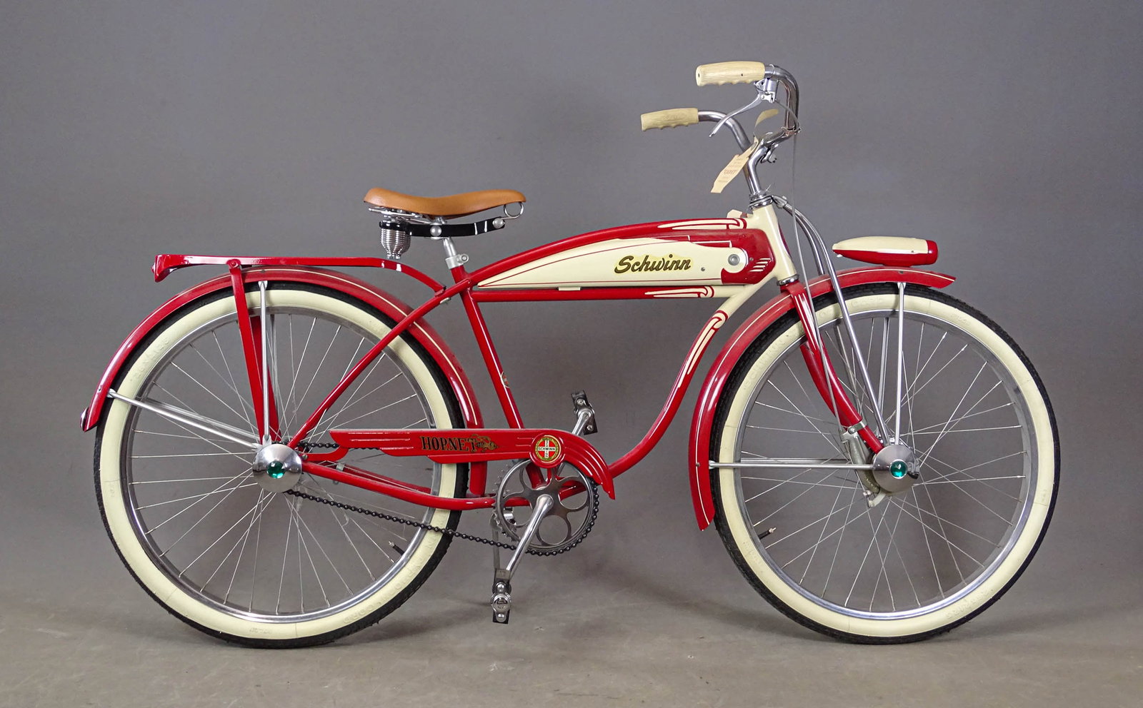 C. 1950's Schwinn Hornet Bicycle: C. 1950's Schwinn Hornet balloon tire bicycle. 18" frame. Schwinn Typhoon Cord Whitewall tires, rear rack, Schwinn pedals. Original condition.