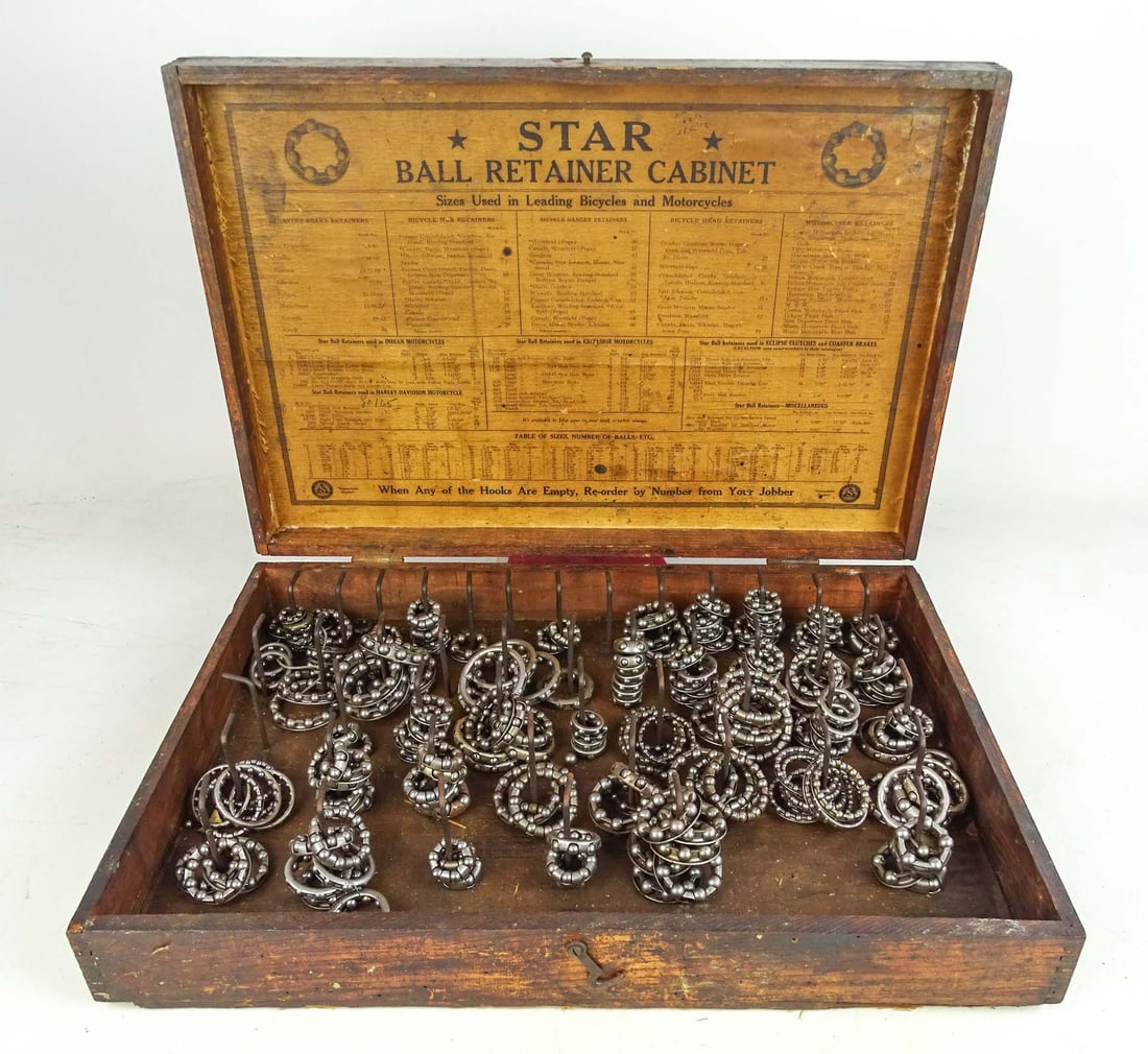 Star Bearing Cabinet: Lot 66 Star bicycle bearing cabinet - early 1900's wooden bearing cabinet with many caged bearings for bicycles and early motorcycles. Loaded with misc bearings. Good condition. Glenn Eames