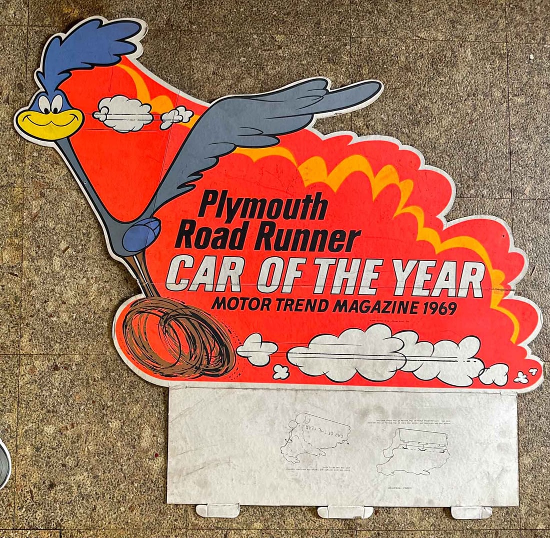 Plymouth Lot: 1969 Plymouth Road Runner heavy card stock cut out, single sided, original factory issued, 26 x 34, folds as shown in photo.
