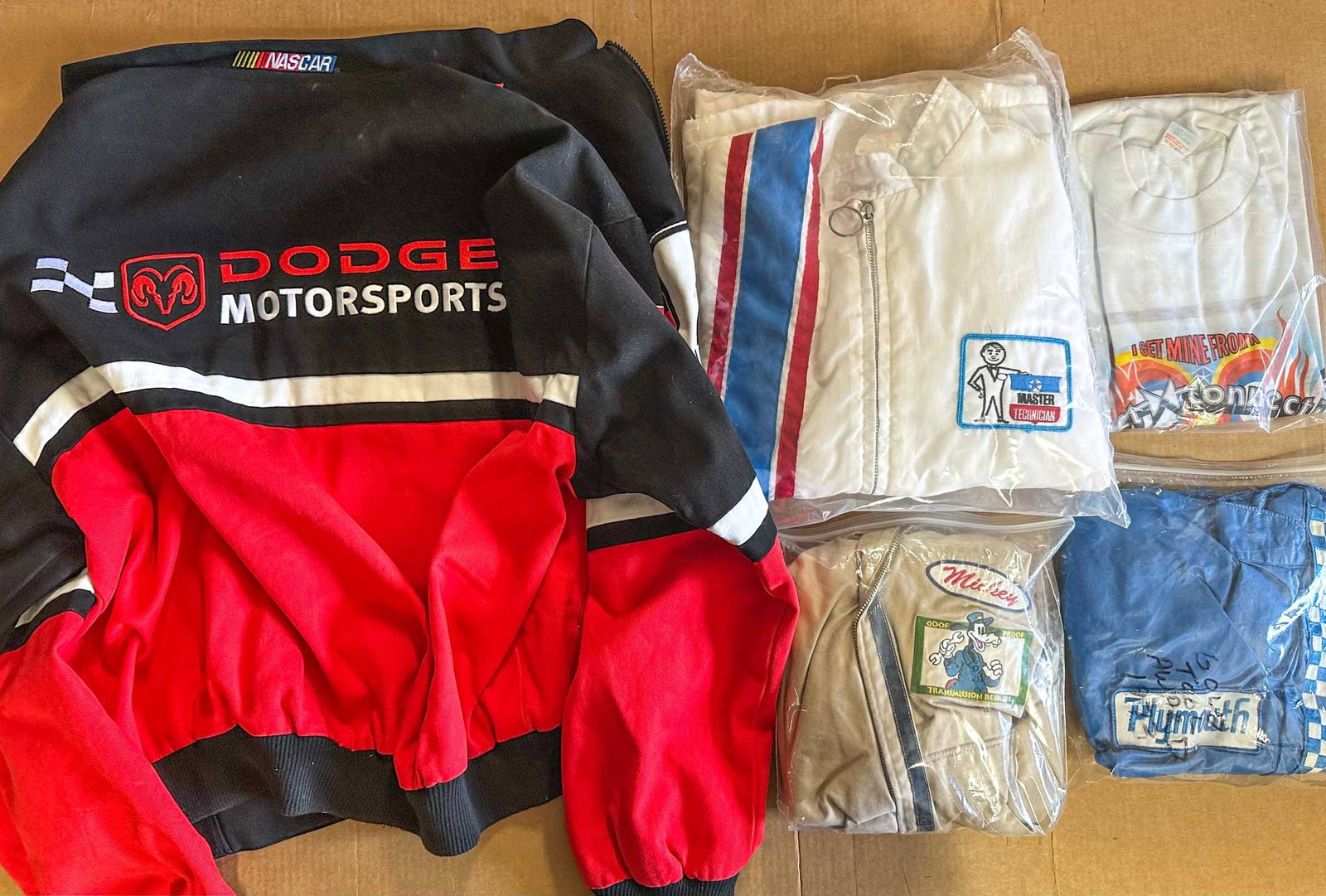 Mopar Jackets Lot: NOS Mopar Dodge jacket, size XXL, Disney, Master Tech, Plymouth jackets and a group of Mopar related hats.