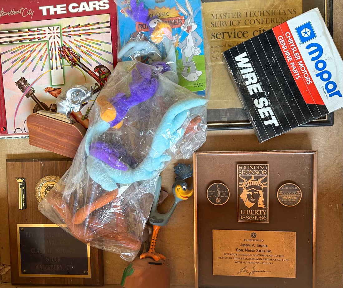 Mopar Lot: Collection of Mopar related items - used dealer triangular flag banner, Petty records, beach ball, Road Runner characters, etc.