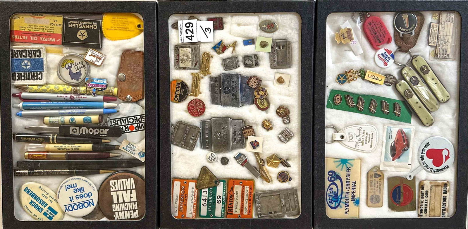 Mopar Lot: Three Riker case collection of Mopar collectibles, employee badges, pocket knives, pins, etc.