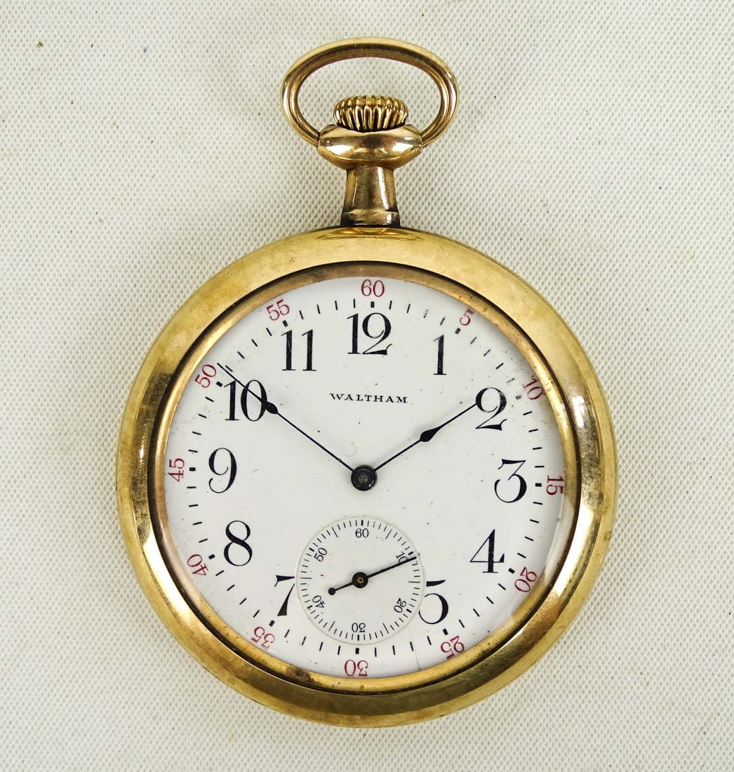 10 Karat Gold Watch: Waltham pocket watch. 1907 movement with 1910 case. Philadelphia watch case. 10 karat gold filled. Marked "ASK THE MAN WHO OWNS ONE". 2" D.. Good condition. Unsure if working.