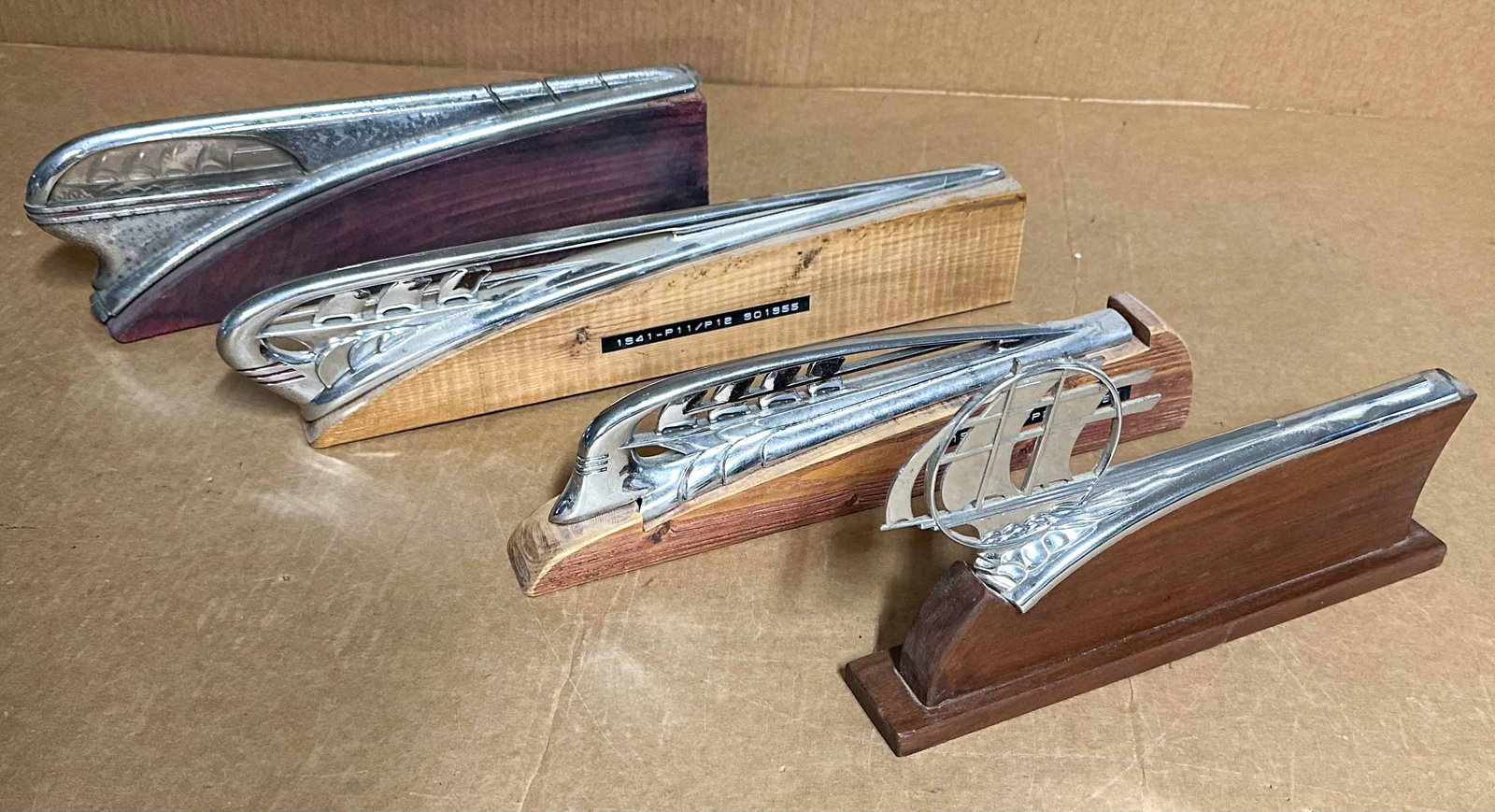 Plymouth Lot: Four Plymouth hood mascots - 1934-35, 1938, 1940, 1941.