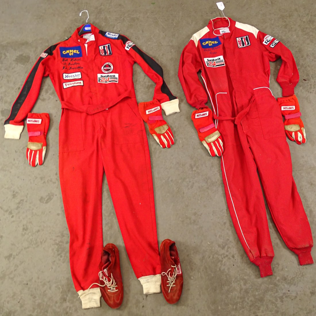 Racing Uniforms Lot: Lot including: (2) Bell racing suits. Medium and large. Marked Bob Hebert and Linda Hebert. Pair of Simpson shoes and (2) pair gloves. Good condition.