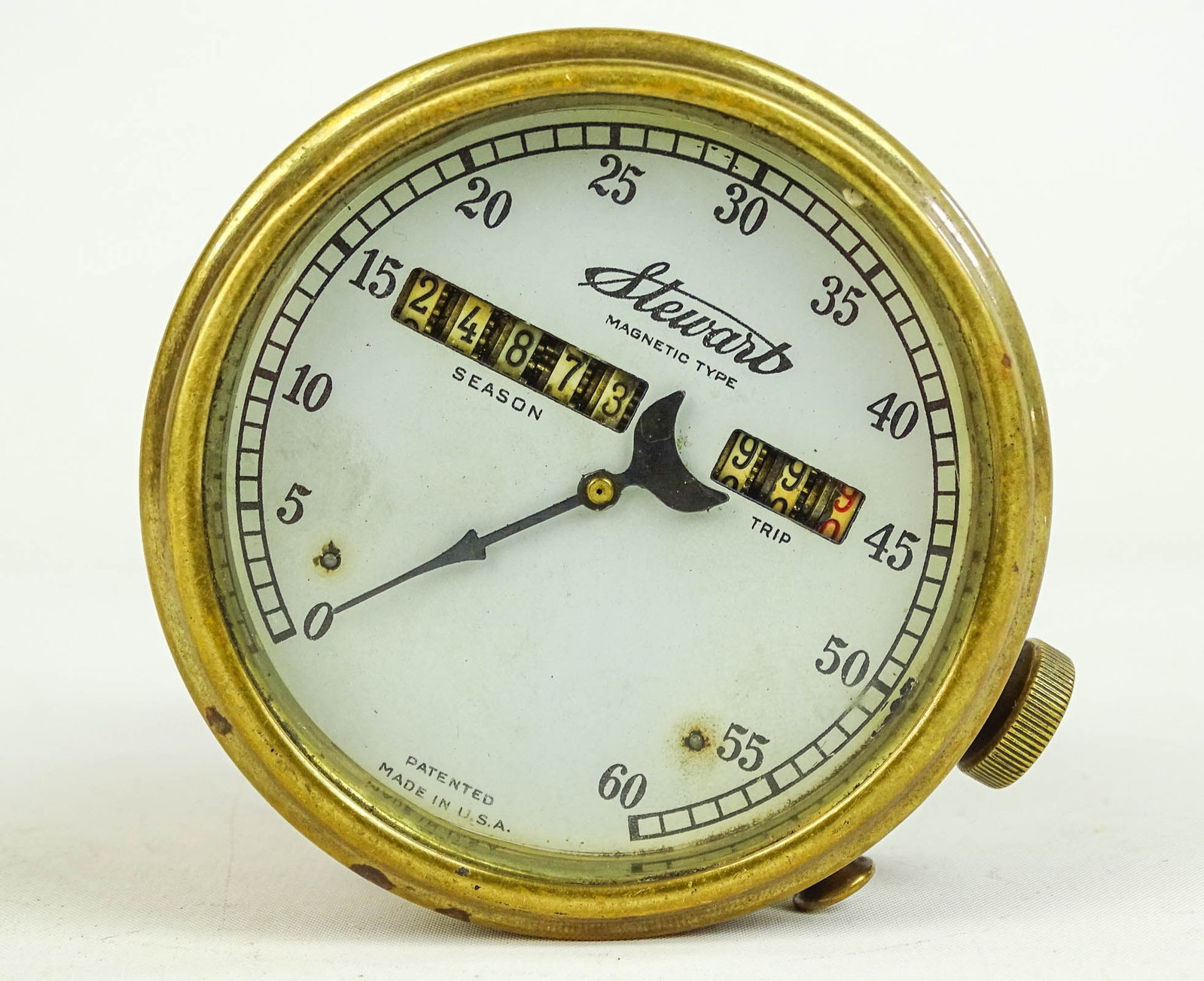 Stewart Speedometer: Stewart speedometer with bracket. 60MPH. Good condition.