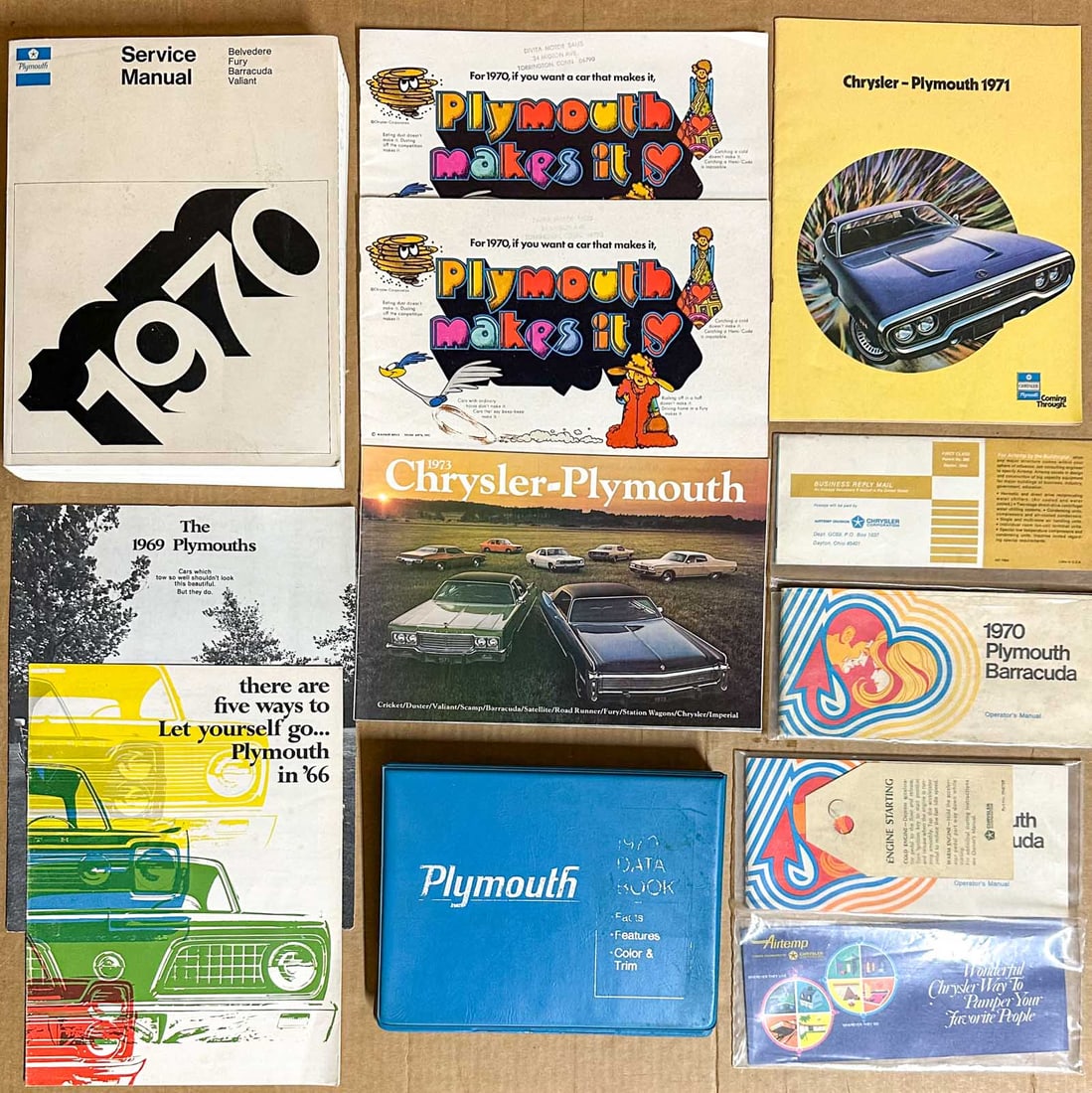 Plymouth Lot: 1970 Plymouth Barracuda group, date book, thermometer, owners manuals, service manual, brochures.