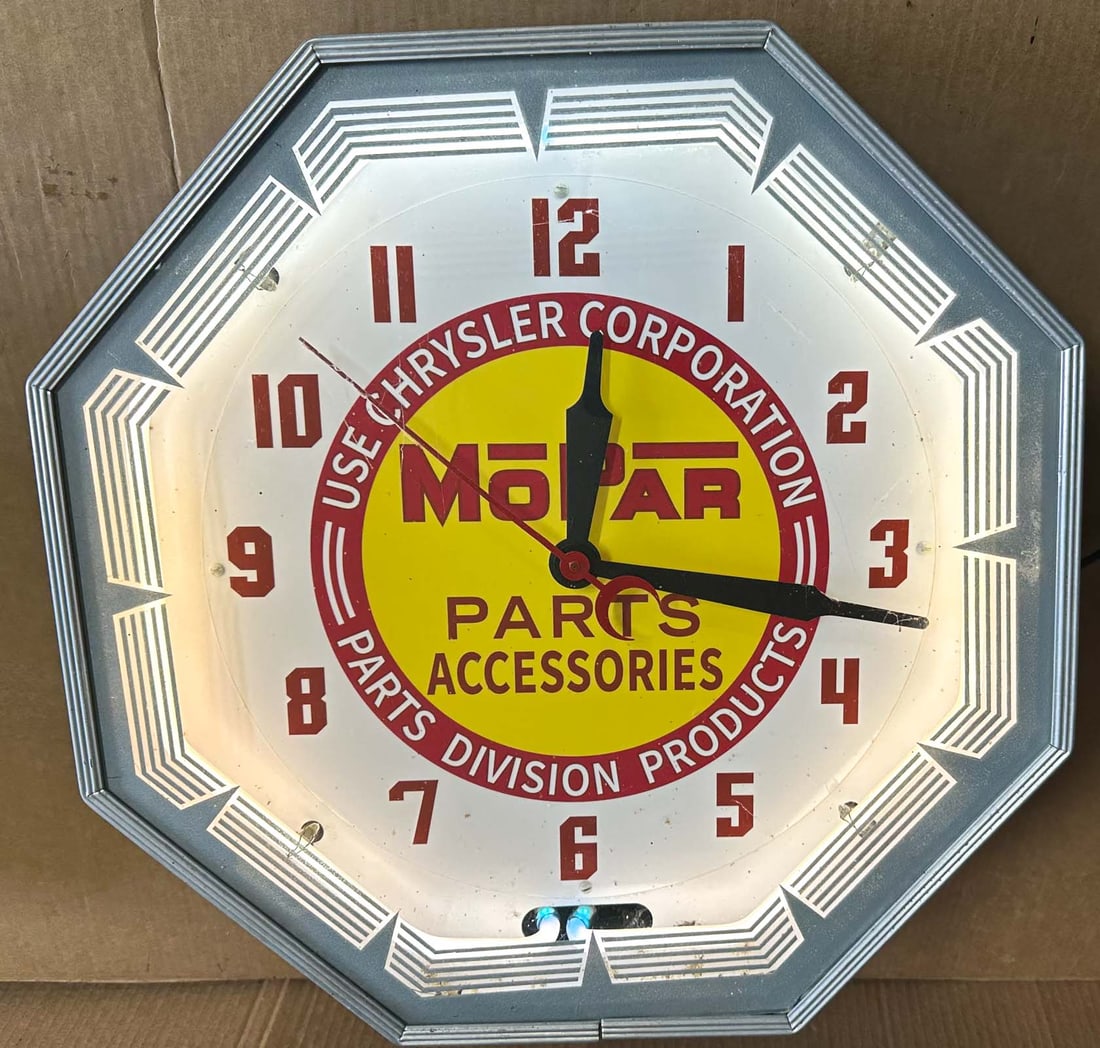Mopar Clock: Mopar showroom clock, 18 x 18, illuminated ring, heavy metal construction, working condition.