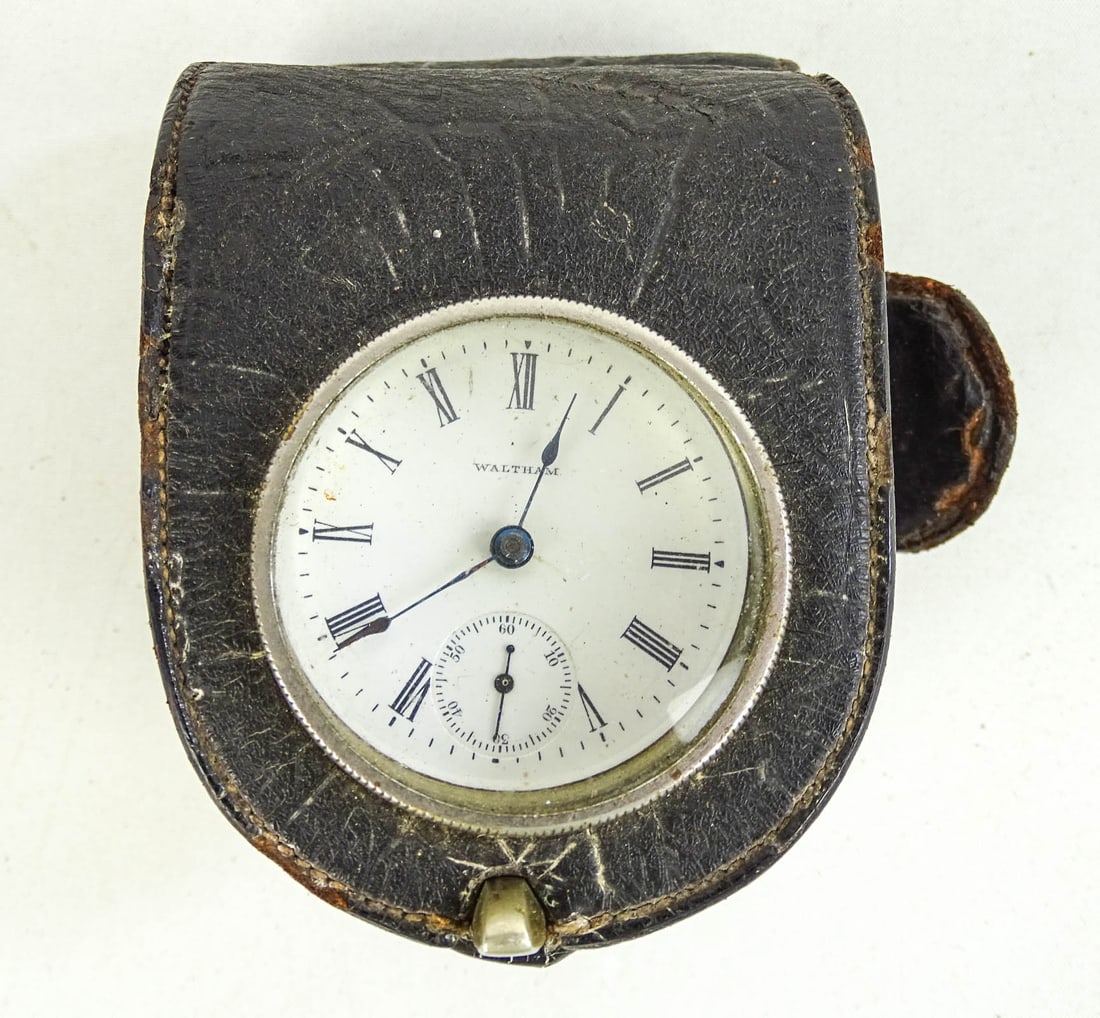 Leather Dashboard Clock: C. 1900-0r leather case dashboard clock. Waltham. Good condition.