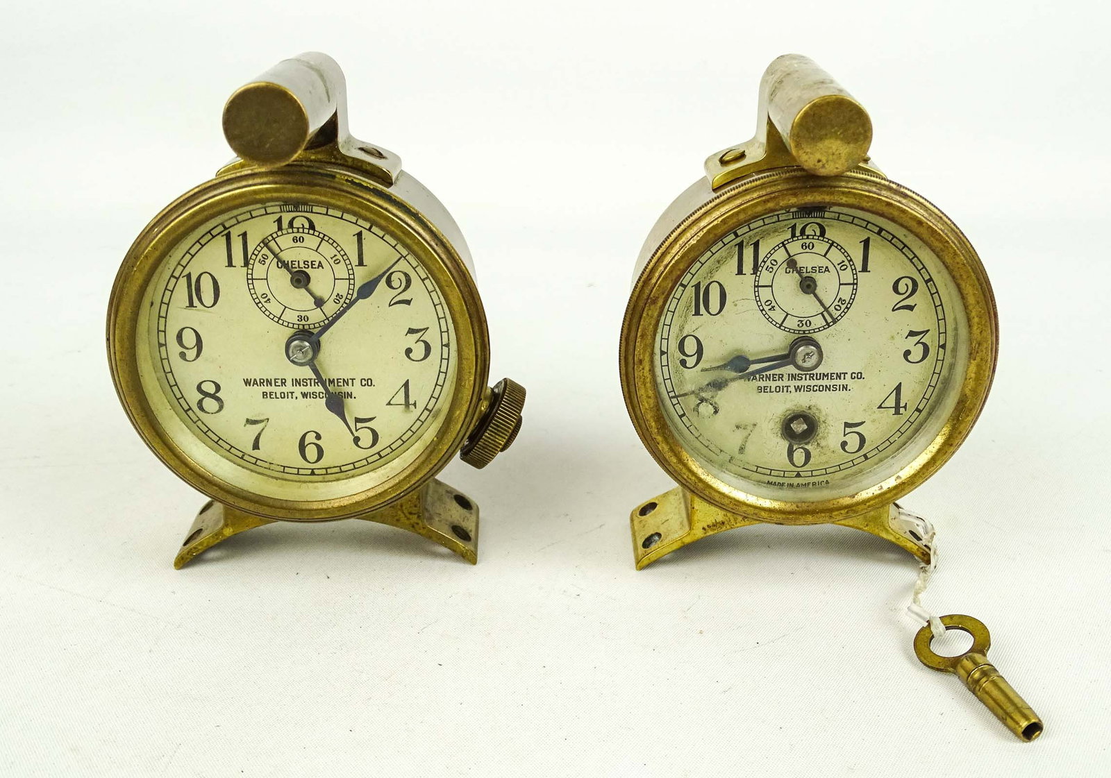 Chelsea Clocks Lot: Lot (2) Chelsea clocks with Warner Mfg. bracket and light. Good condition.