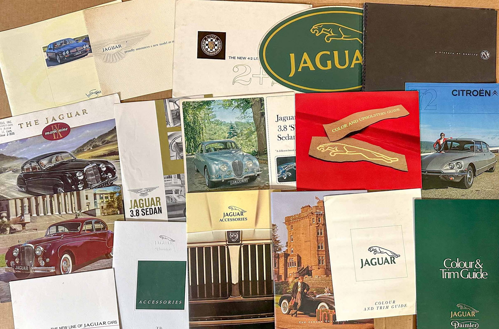 Jaguar Lot: Jaguar literature collection - brochures, tech info, color charts, including 1986 Group 44 Racing press kit.