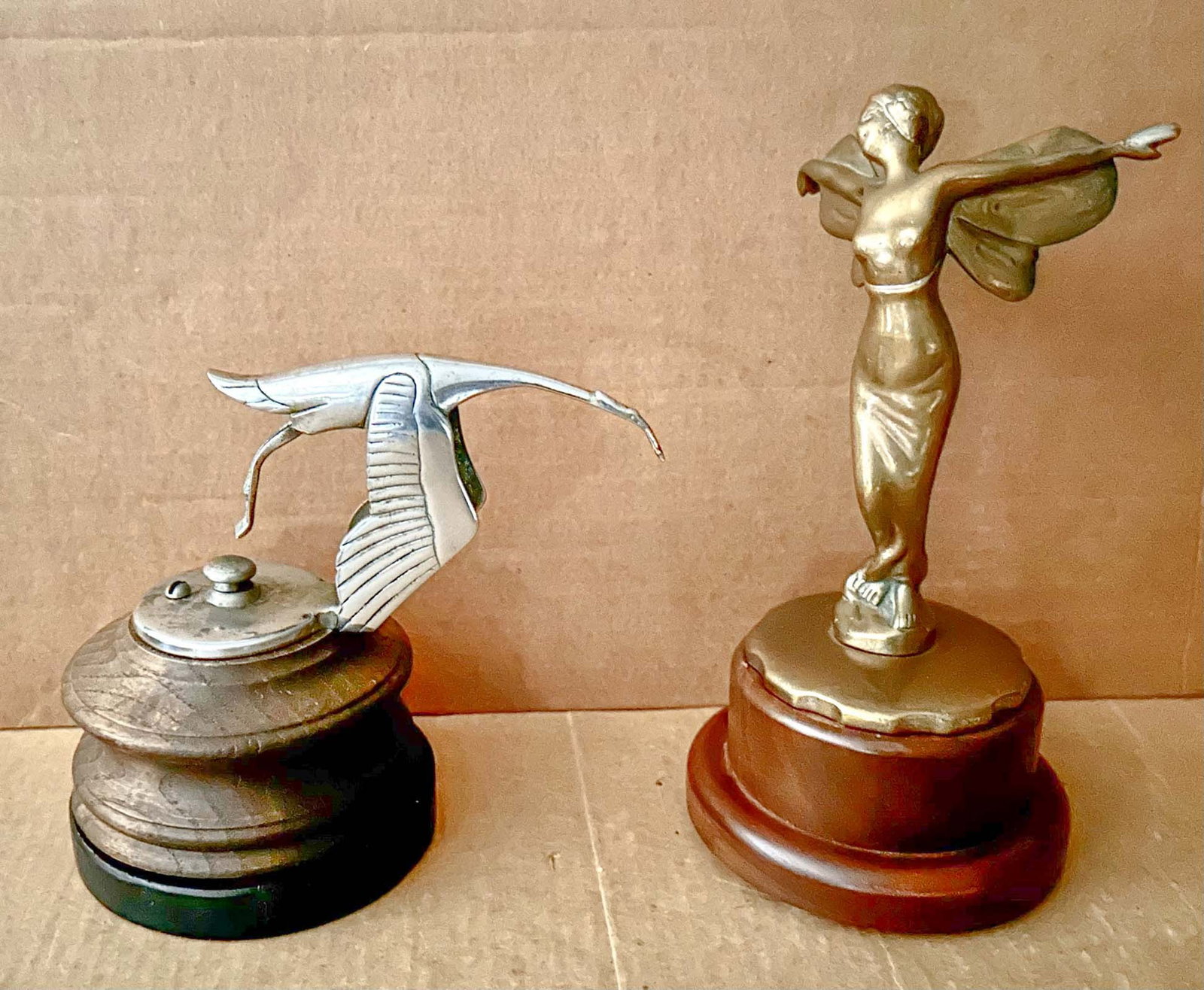 Mascot Lot: Two mascots - Frederick Bazin Hispano stork style paperweight, 7.5 base to tip of beak and Winged Goddess, by design attributed to A Renevey, 7.5 high.